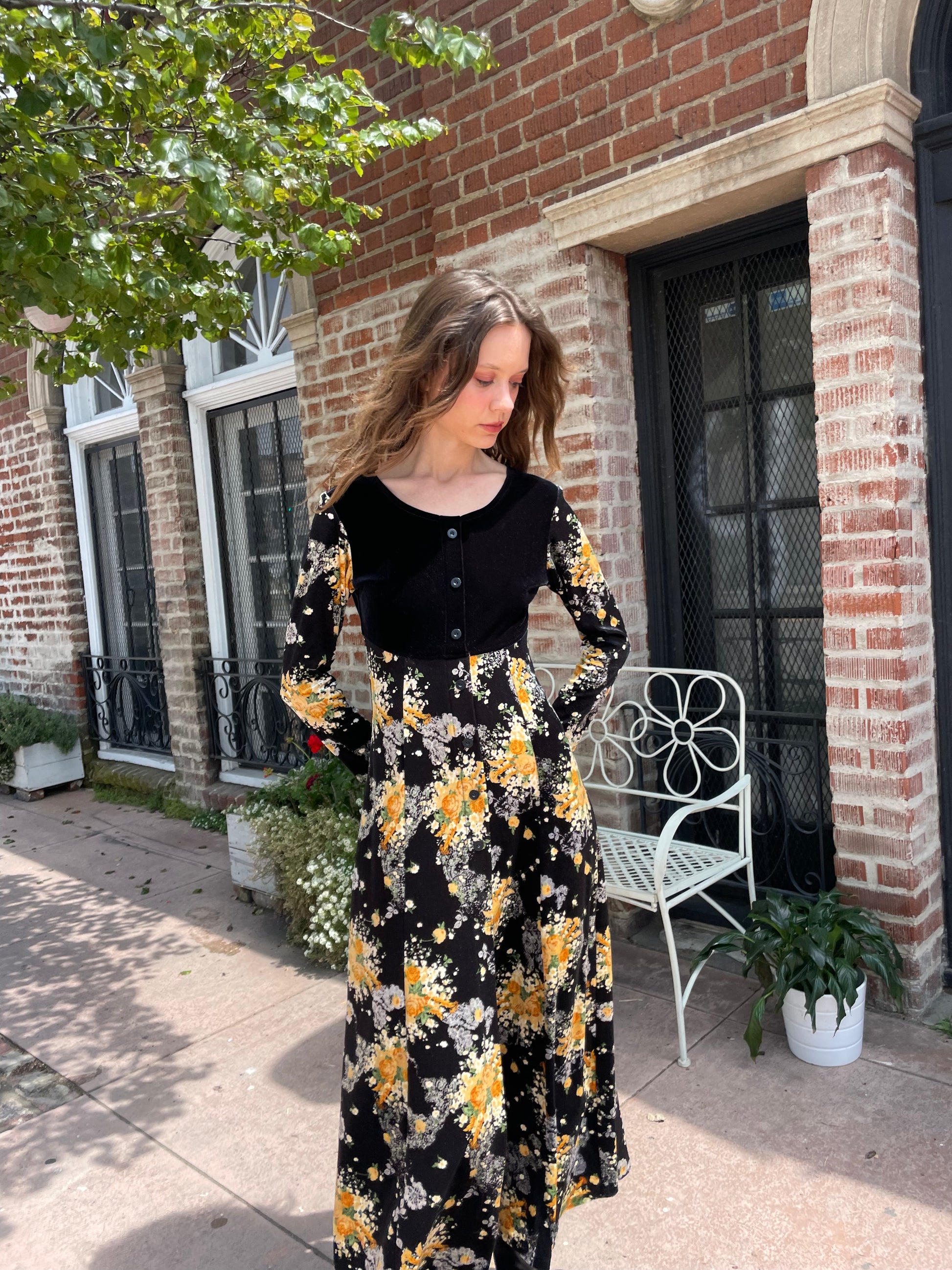 girl wearing long sleeve black and yellow dress