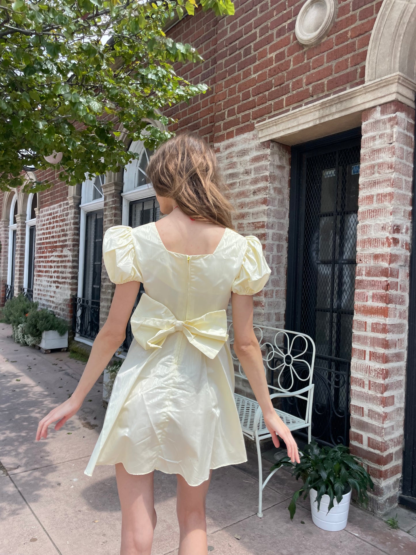 girl wearing yellow short dress