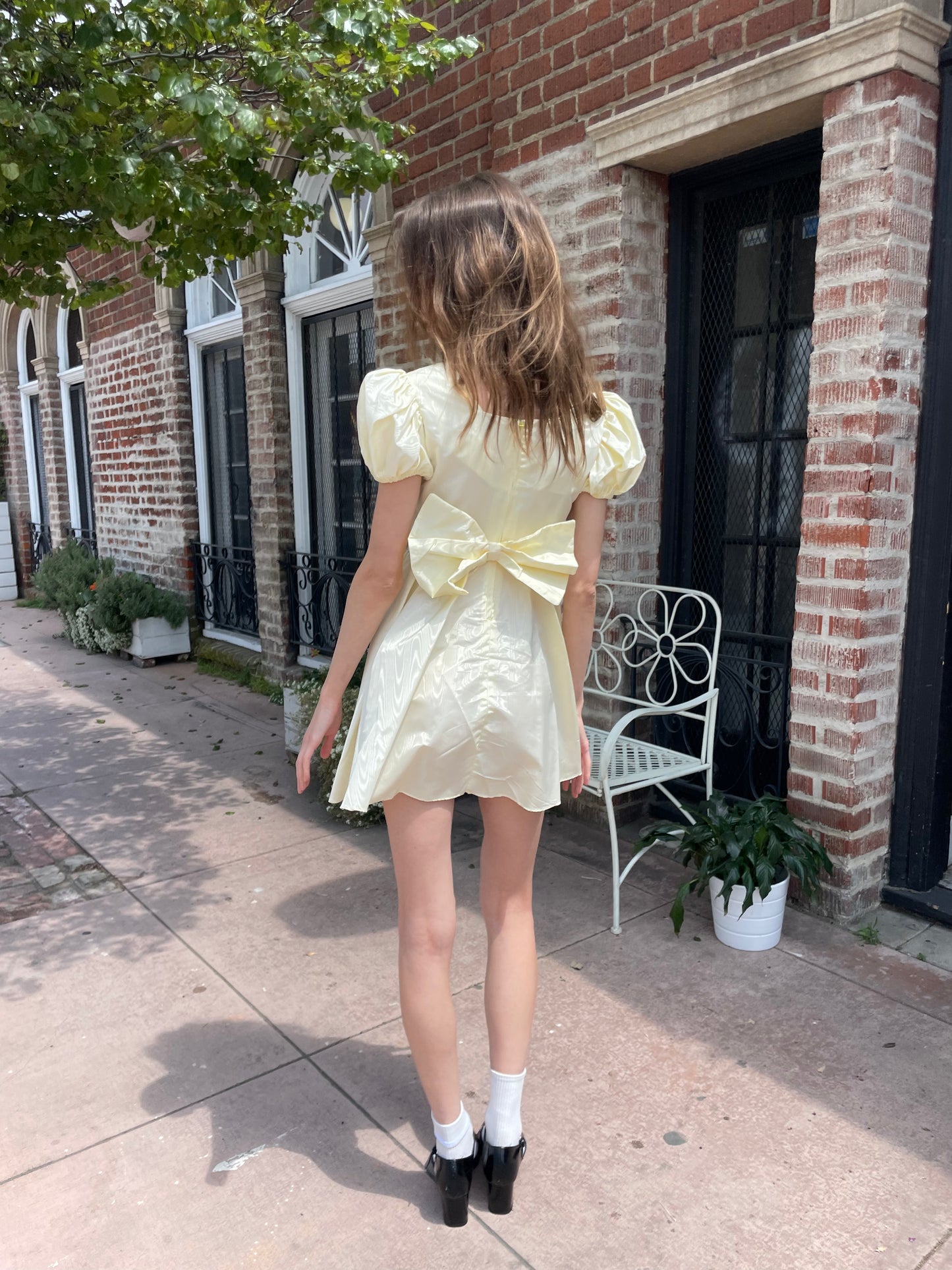 girl wearing yellow short dress