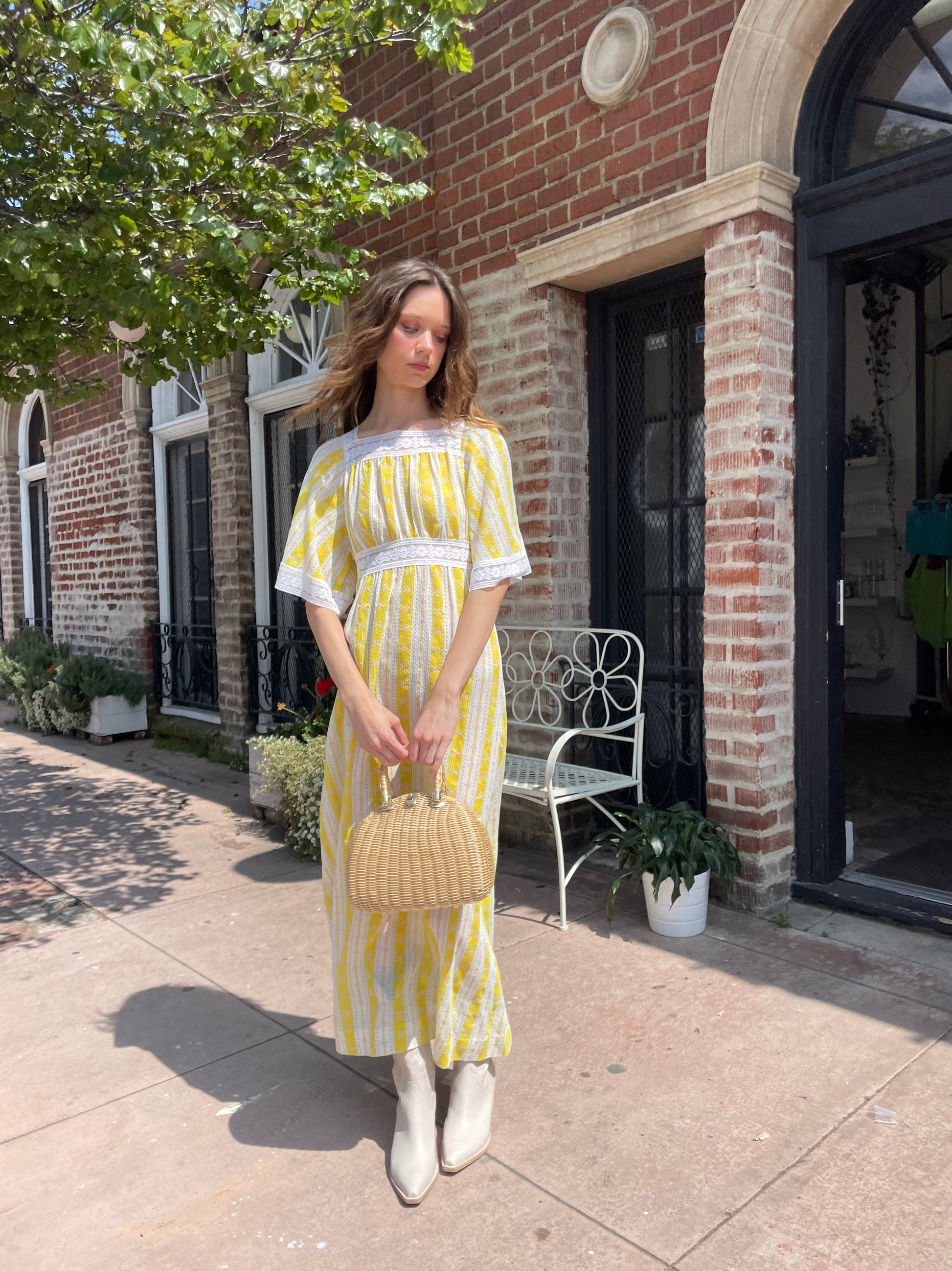 girl wearing long yellow and lace dress