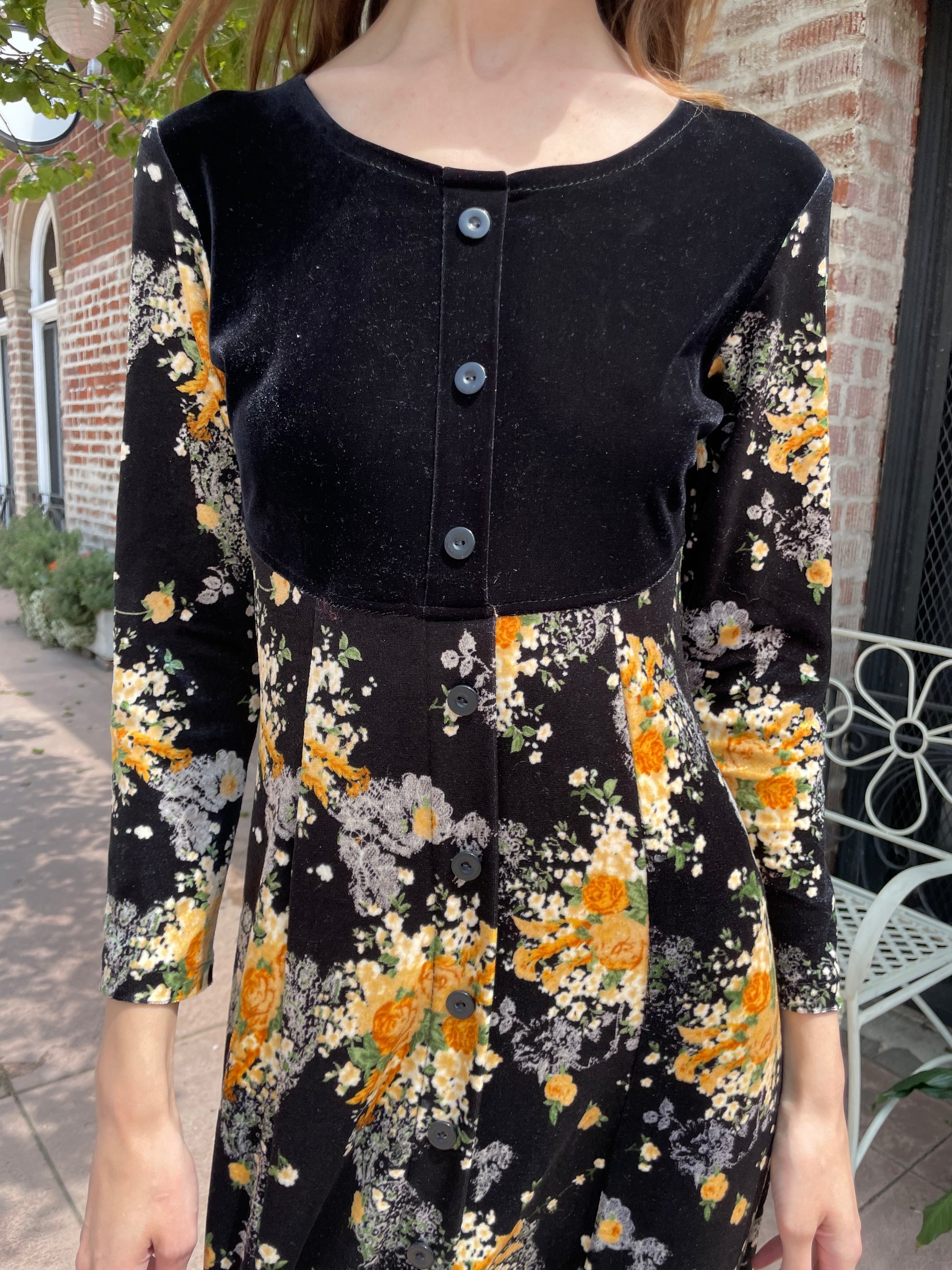 girl wearing long sleeve black and yellow dress