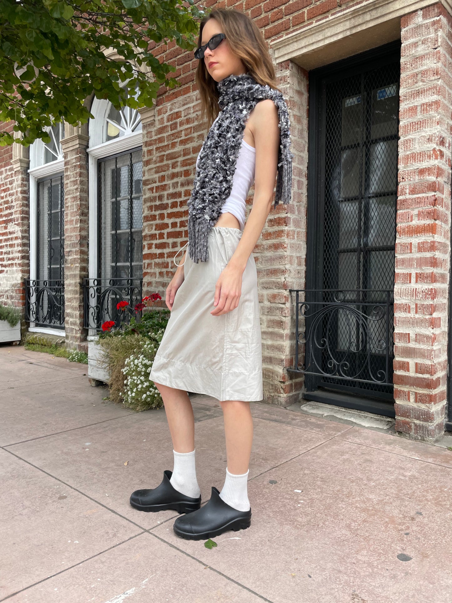 girl in white top and silk skirt