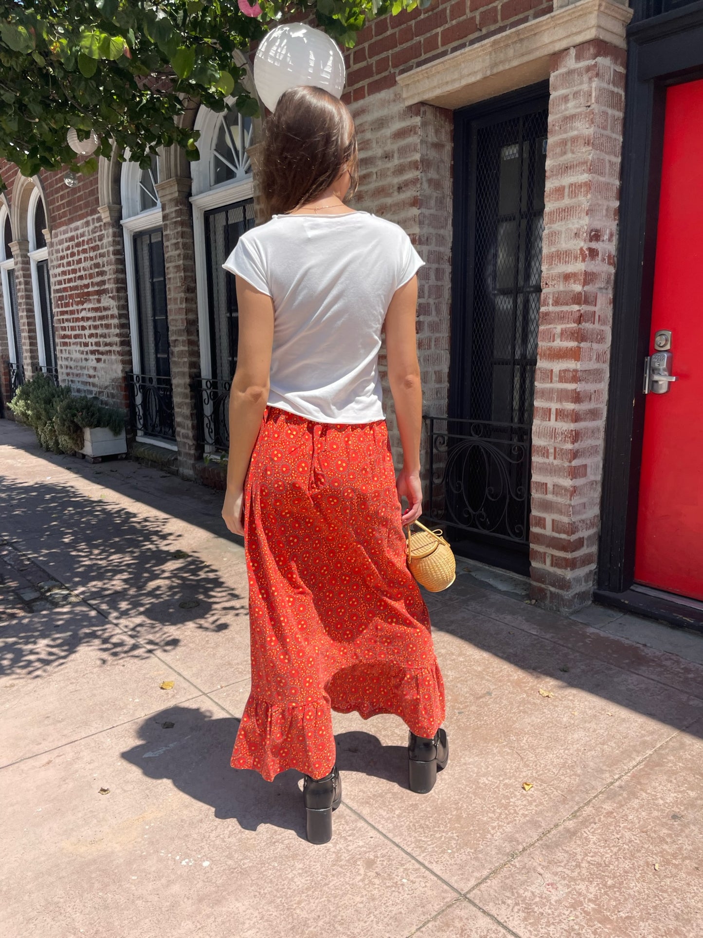 orange maxi skirt and white top