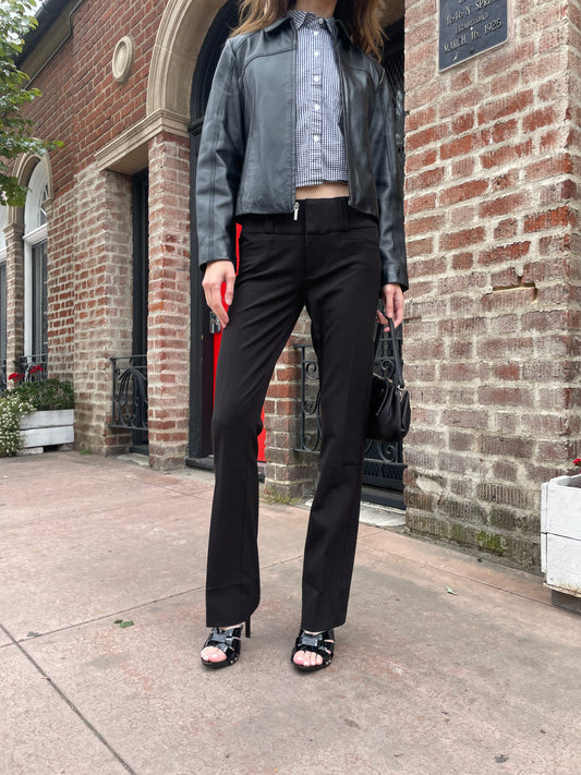 girl wearing leather jacket and black pants