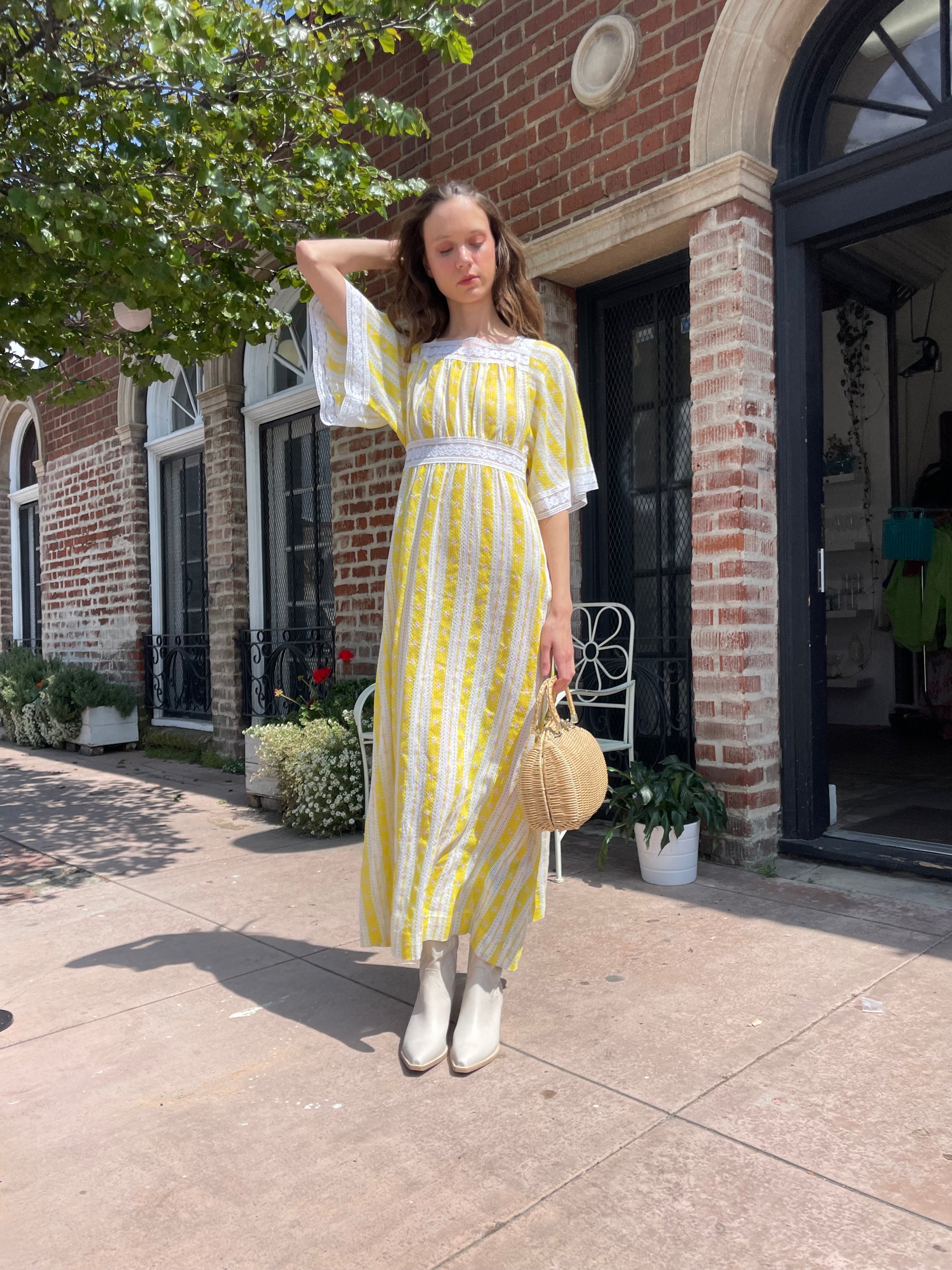 girl wearing long yellow and lace dress
