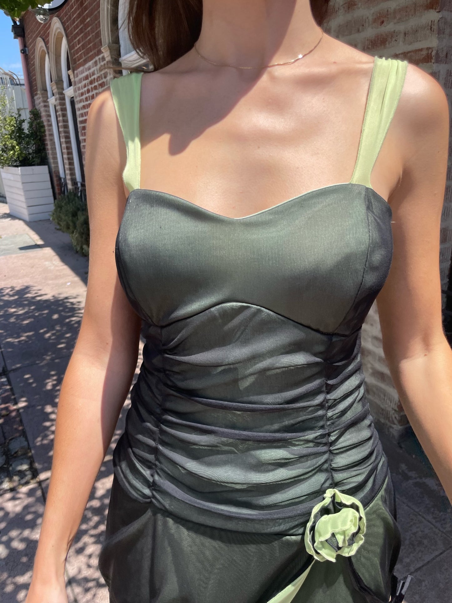 girl in black and green dress
