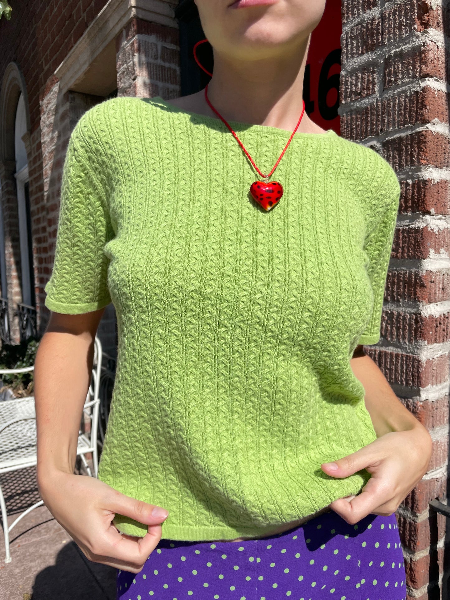 girl in green top and purple skirt