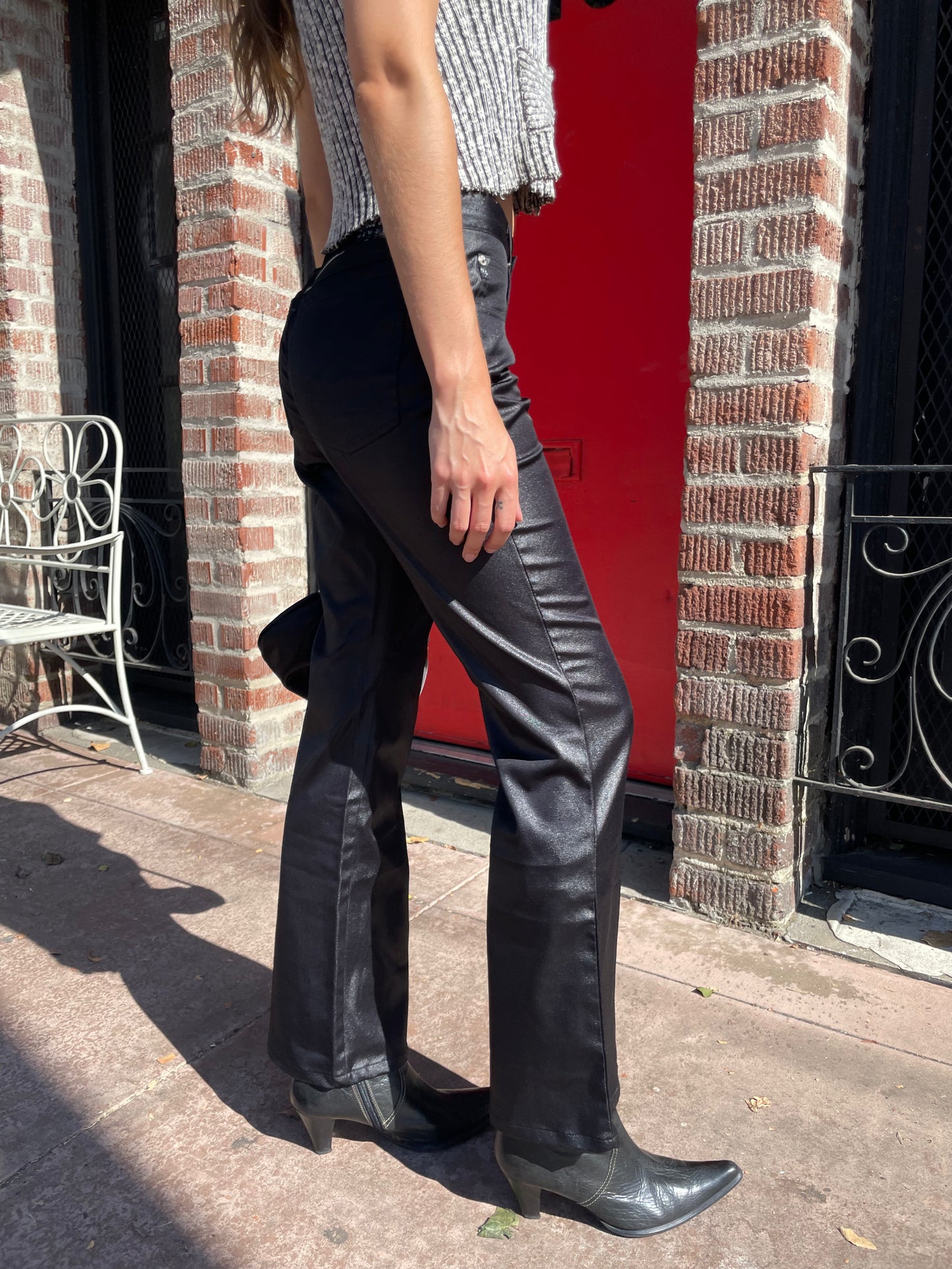 girl in brown and white top and black pants