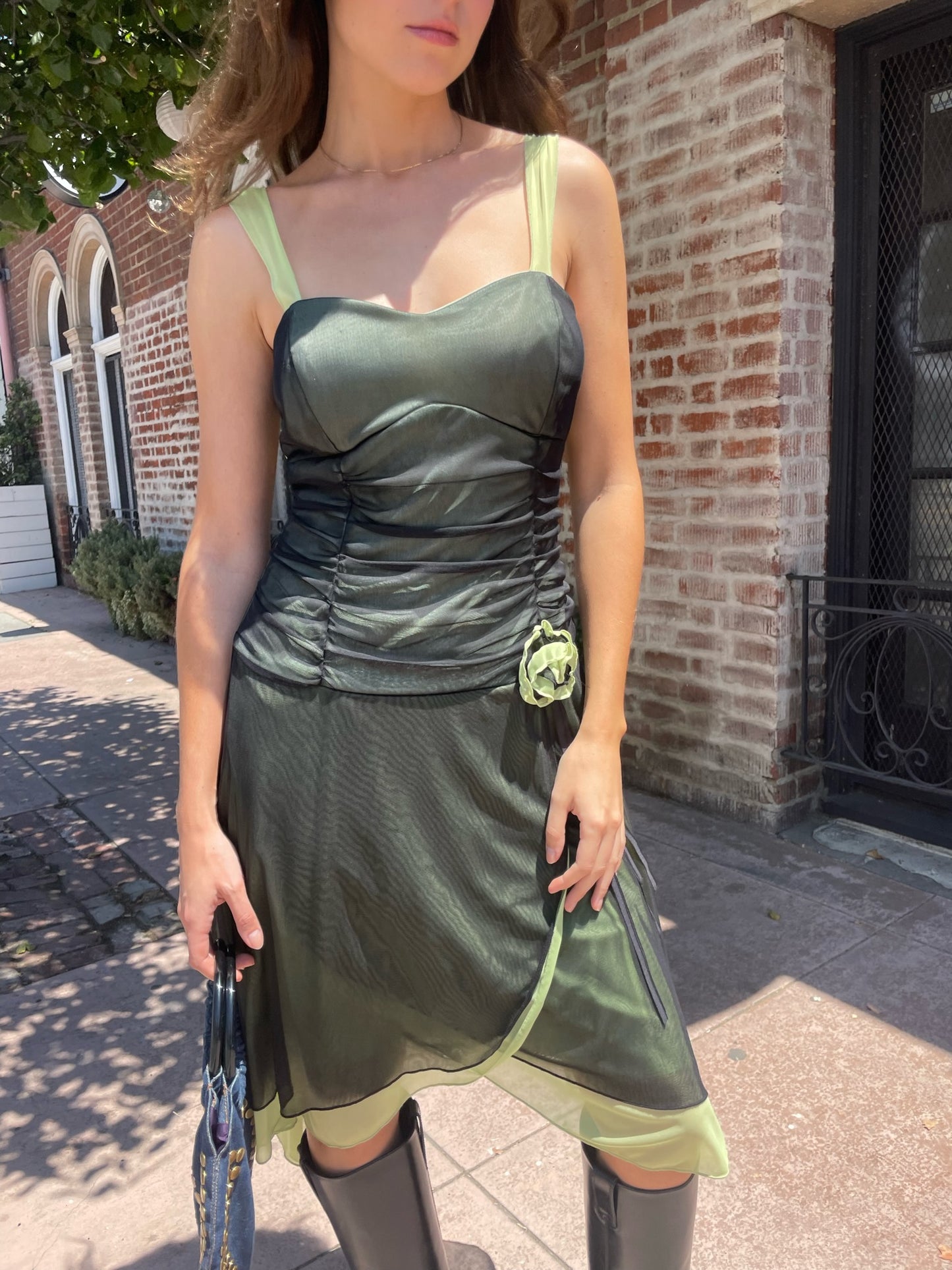 girl in black and green dress