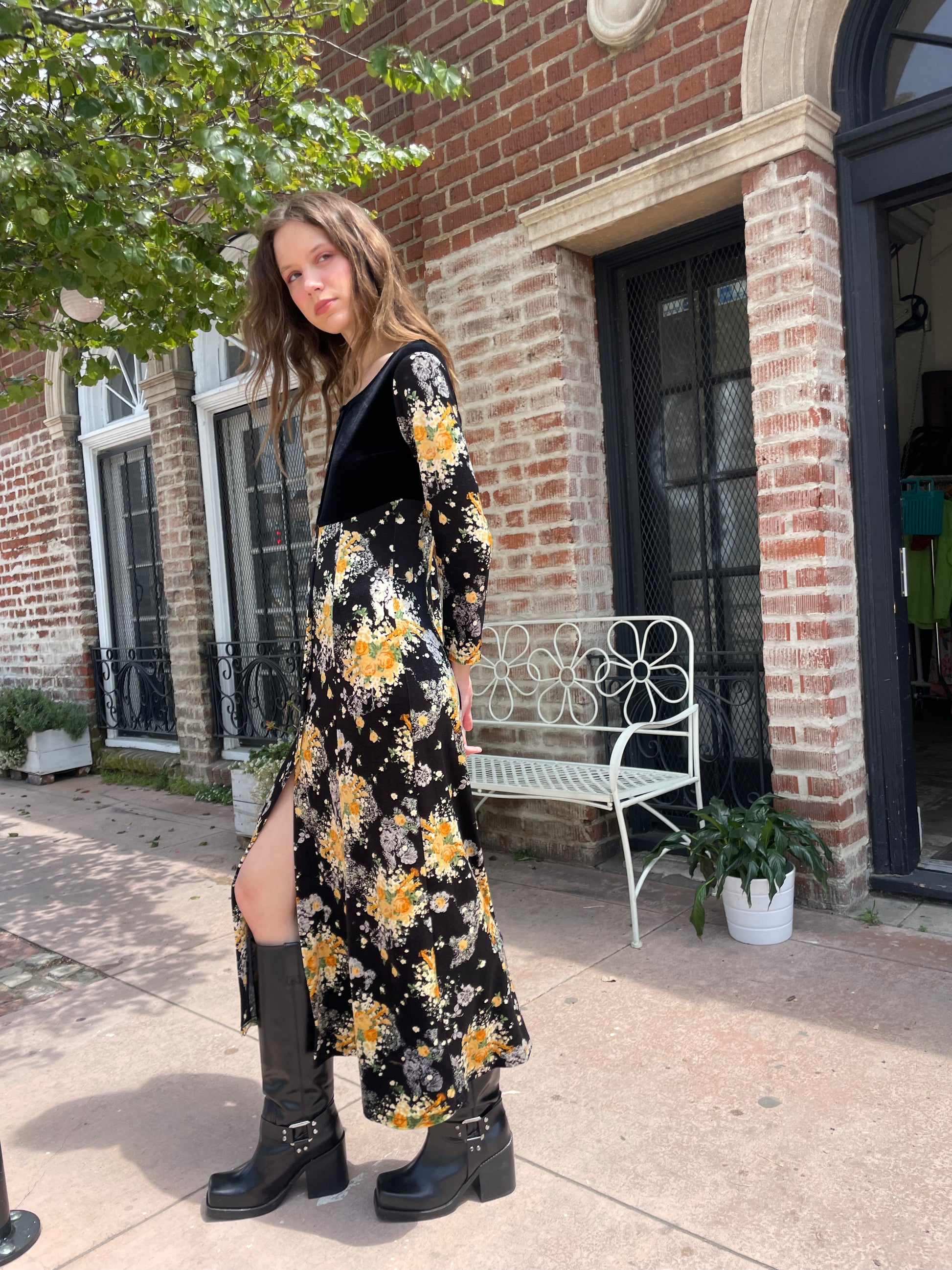 profile of girl wearing long sleeve black and yellow dress
