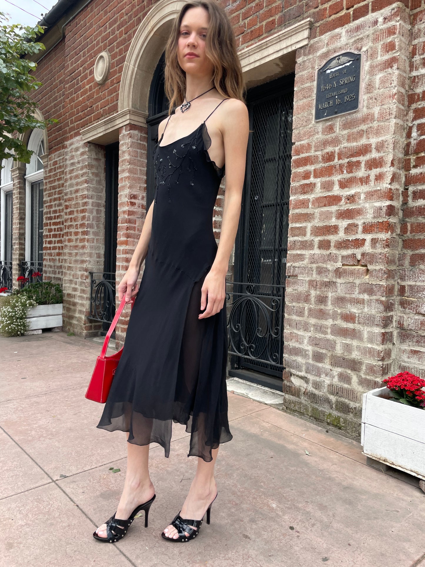 girl in black skinny strap dress