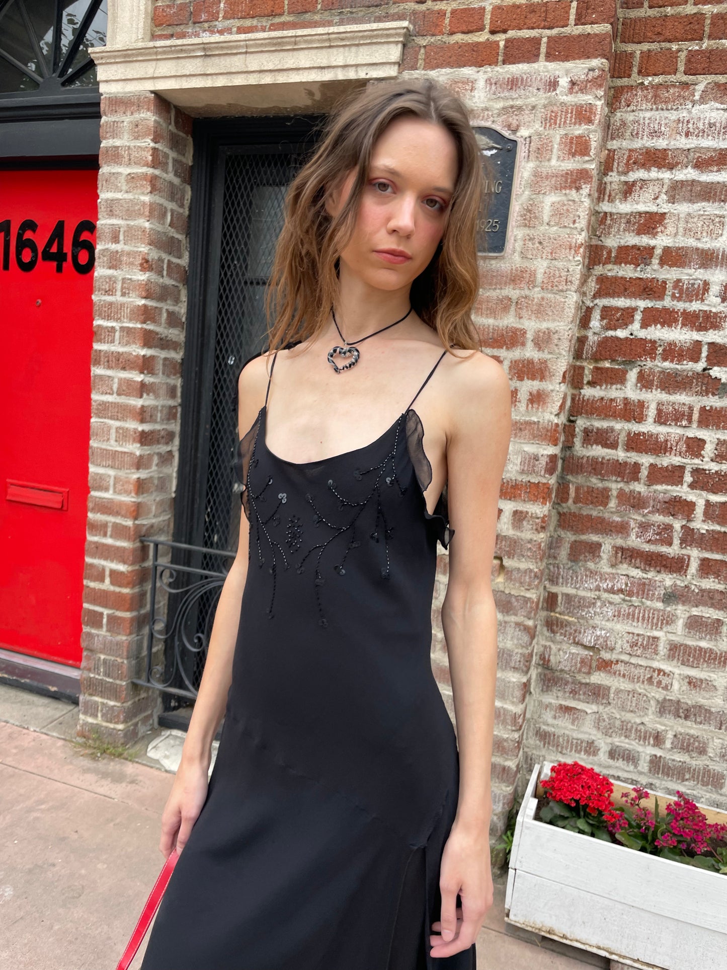 girl in black skinny strap dress