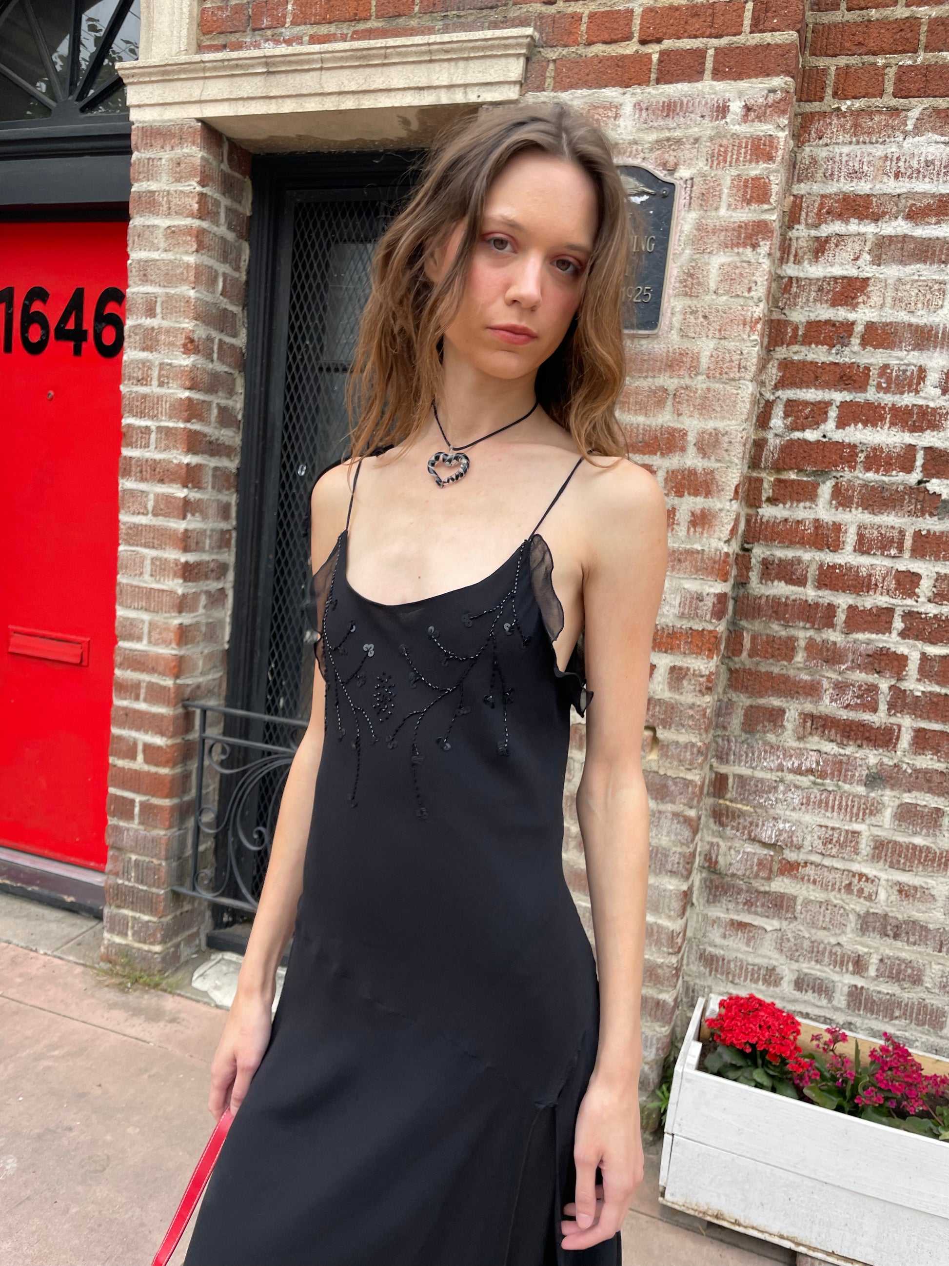 girl in black skinny strap dress