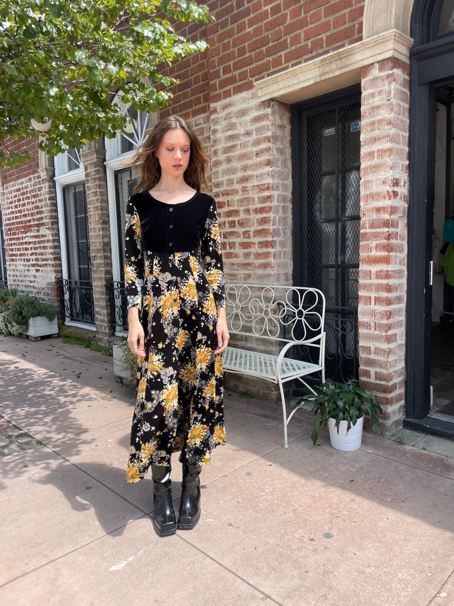 girl wearing long sleeve black and yellow dress