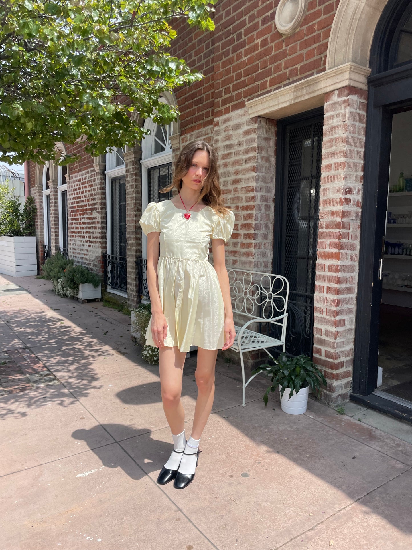 girl wearing yellow short dress