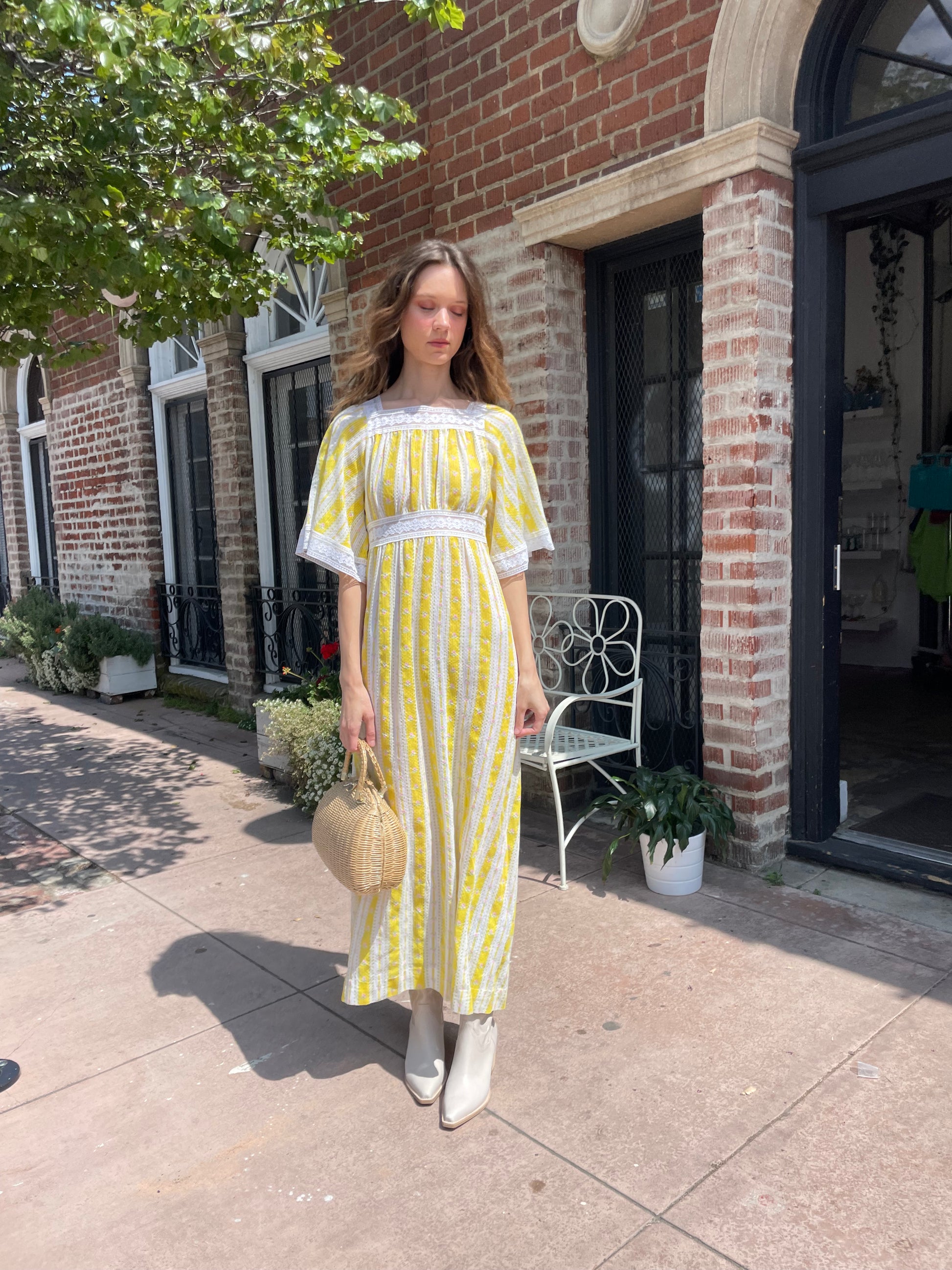 girl wearing long yellow and lace dress