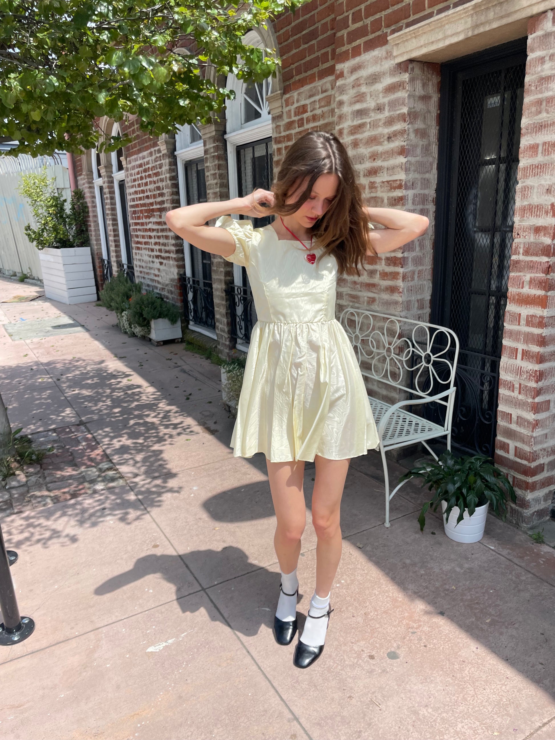 girl wearing yellow short dress