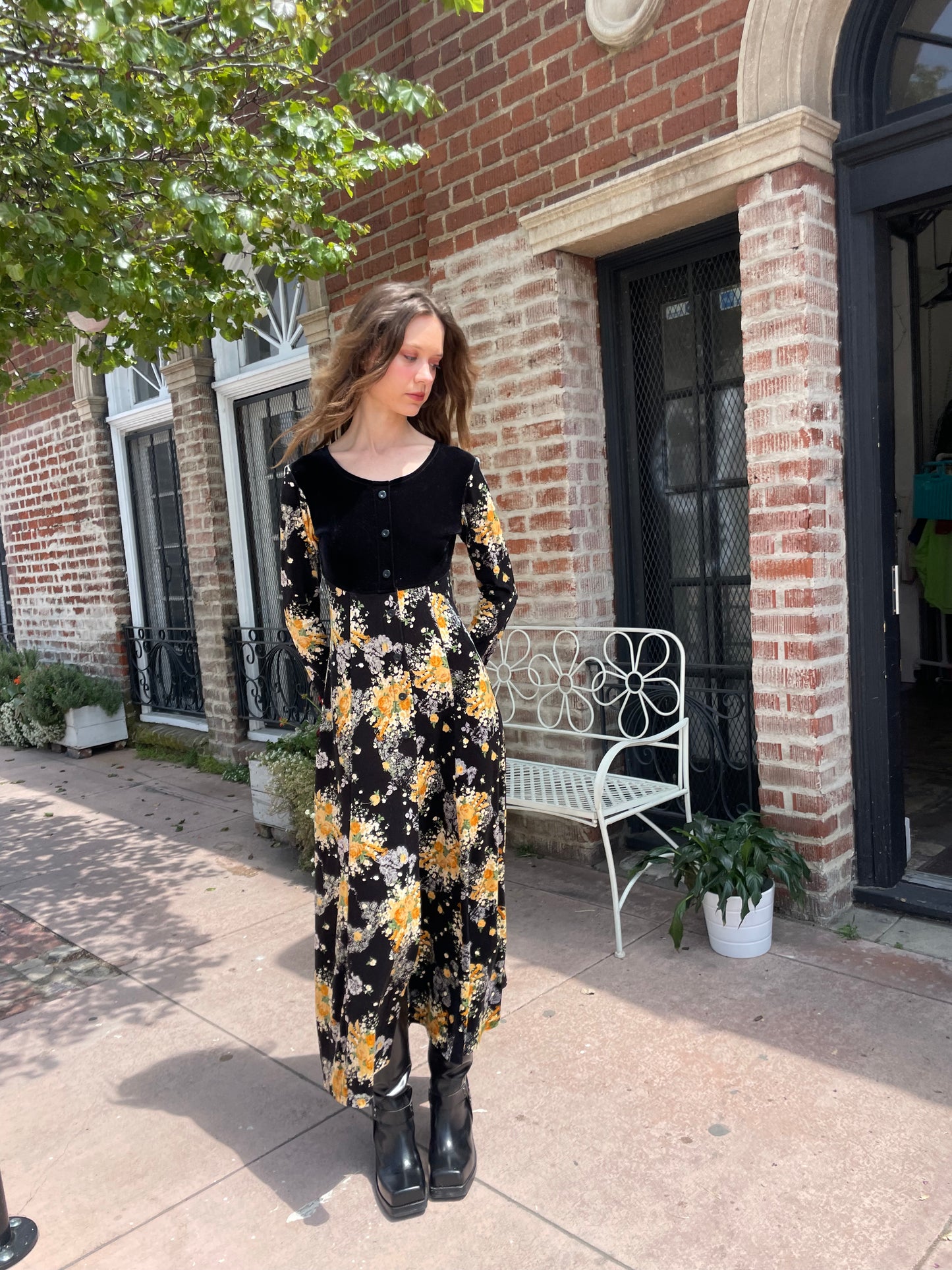 girl wearing long sleeve black and yellow dress