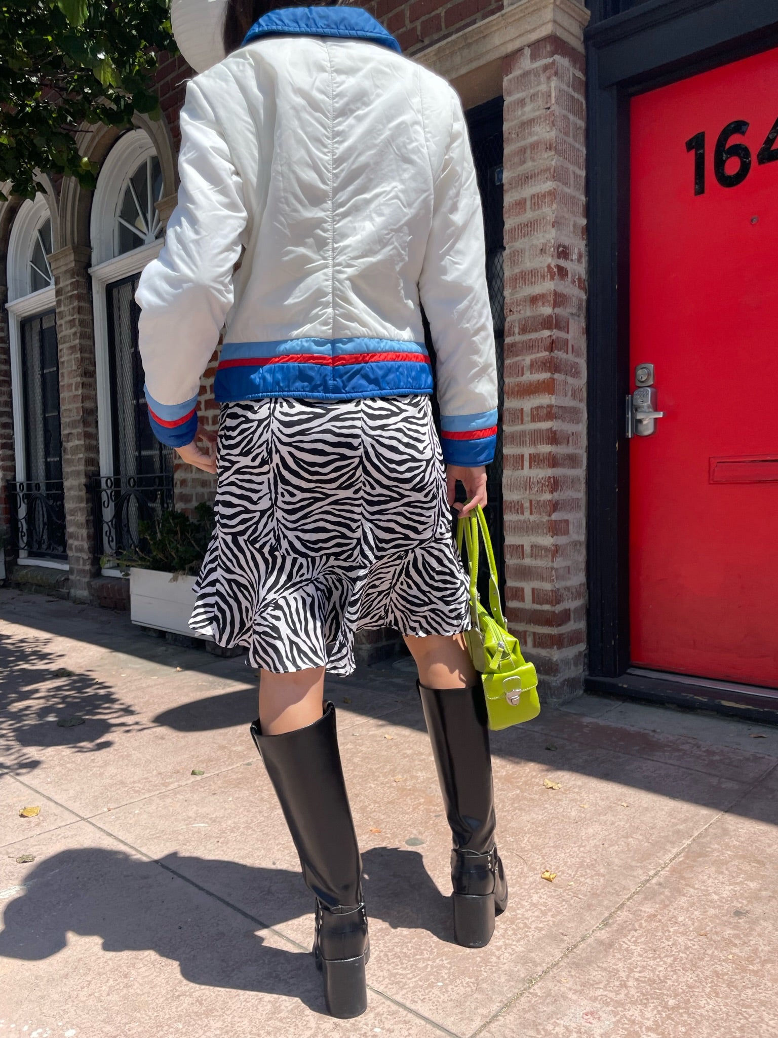 girl in zebra print skirt and sport jacket