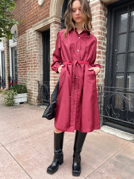 girl in red and black trench
