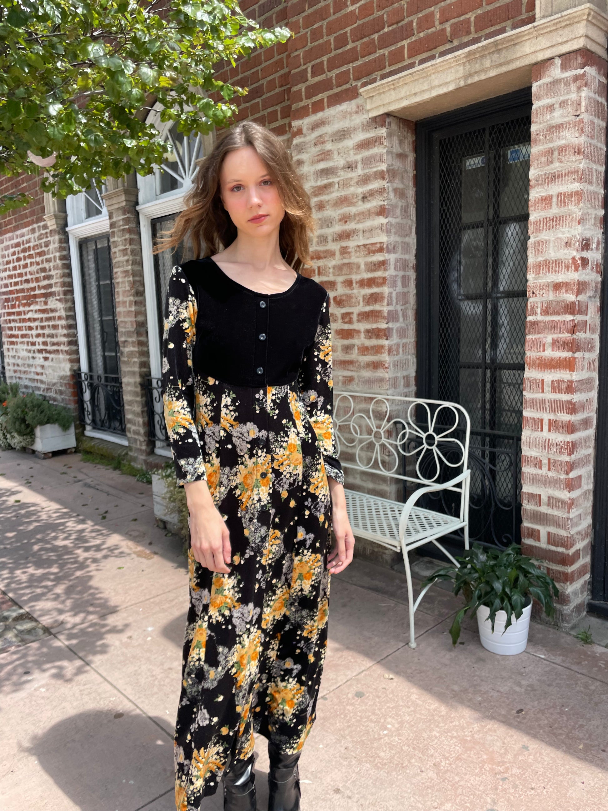 girl wearing long sleeve black and yellow dress