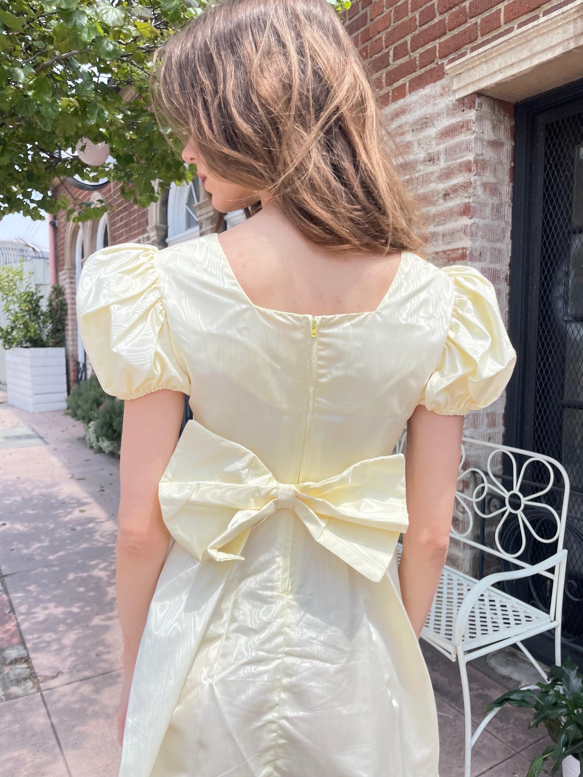 girl wearing yellow short dress