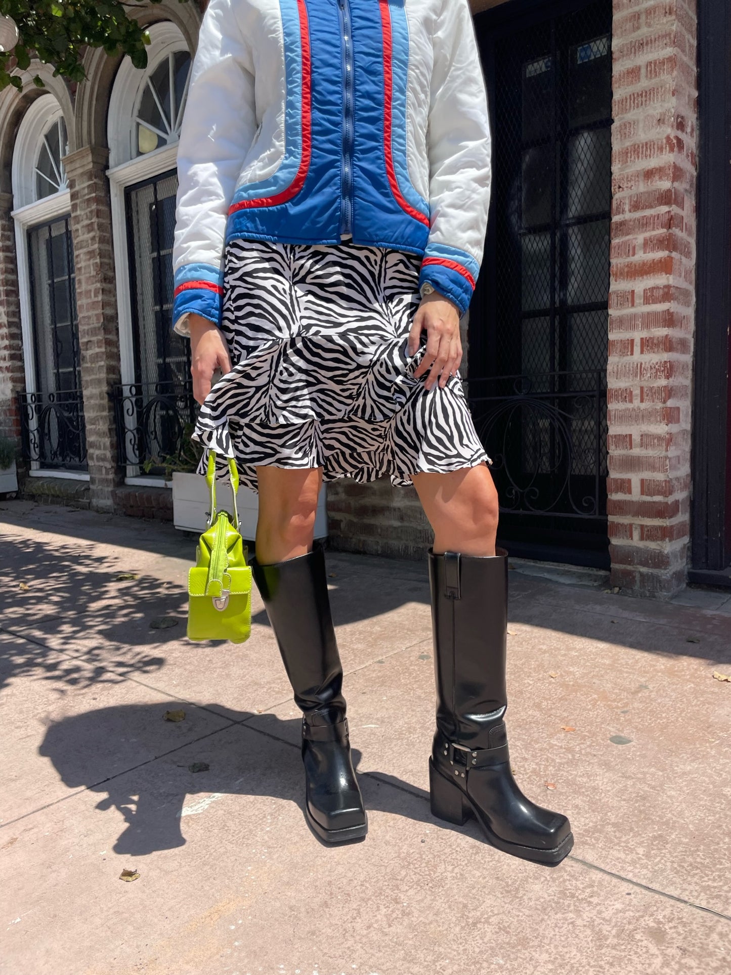 girl in zebra print skirt and sport jacket