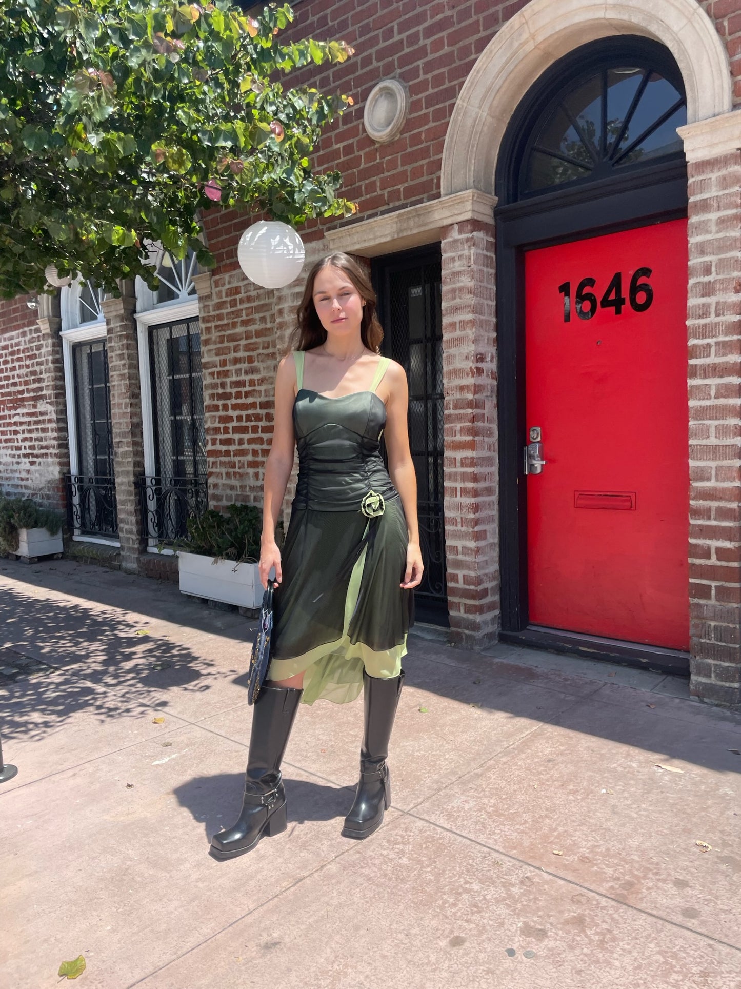 girl in black and green dress
