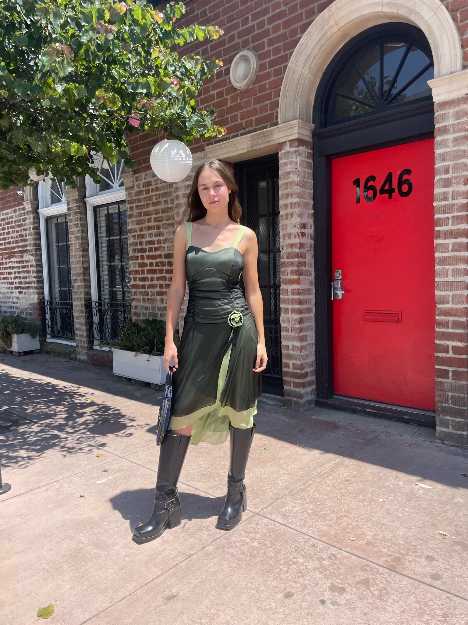 girl in black and green dress