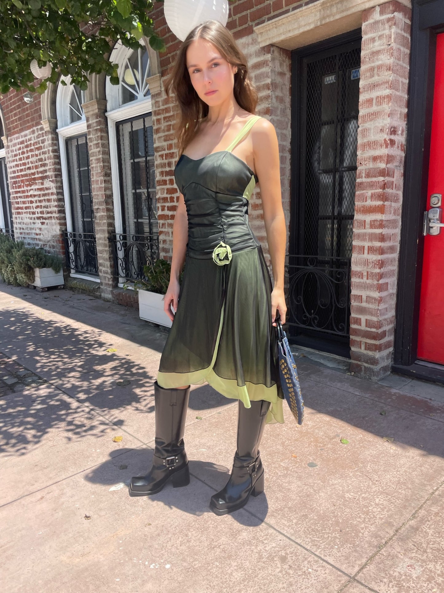 girl in black and green dress