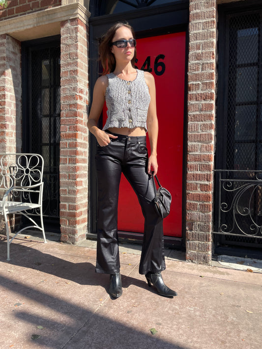 girl in brown and white top and black pants