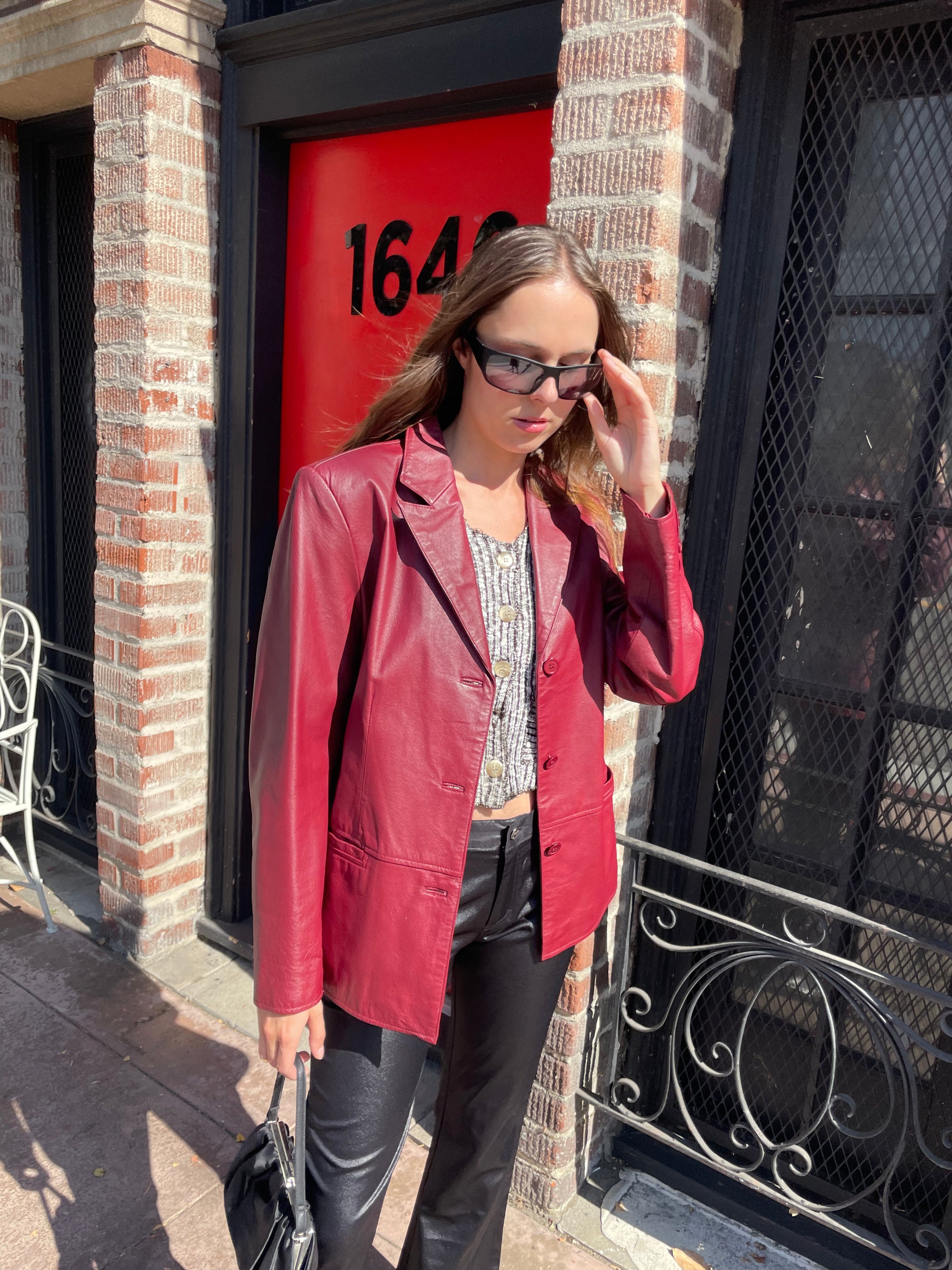 girl in red leather jacket and black leather pants