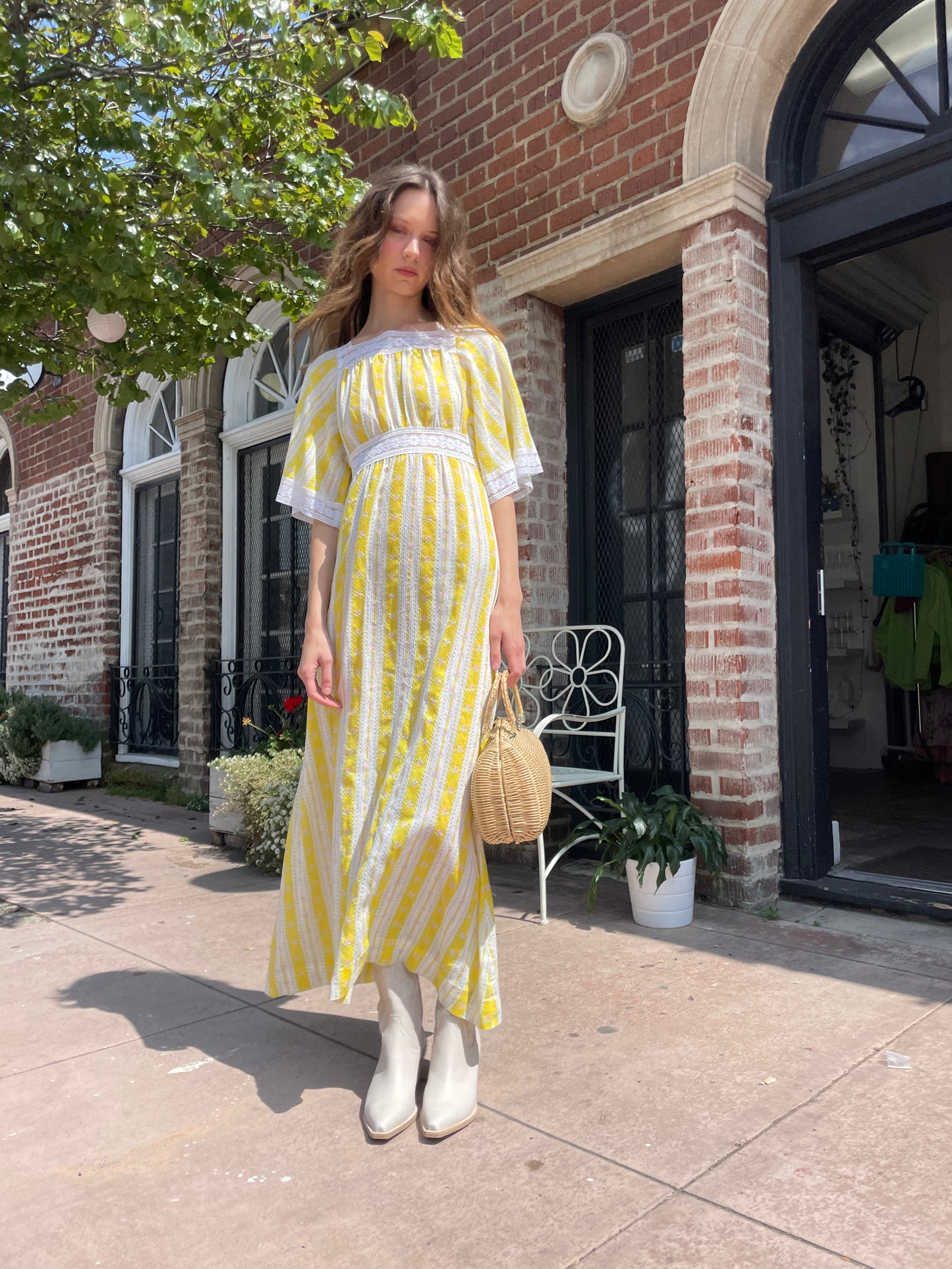 girl wearing long yellow and lace dress