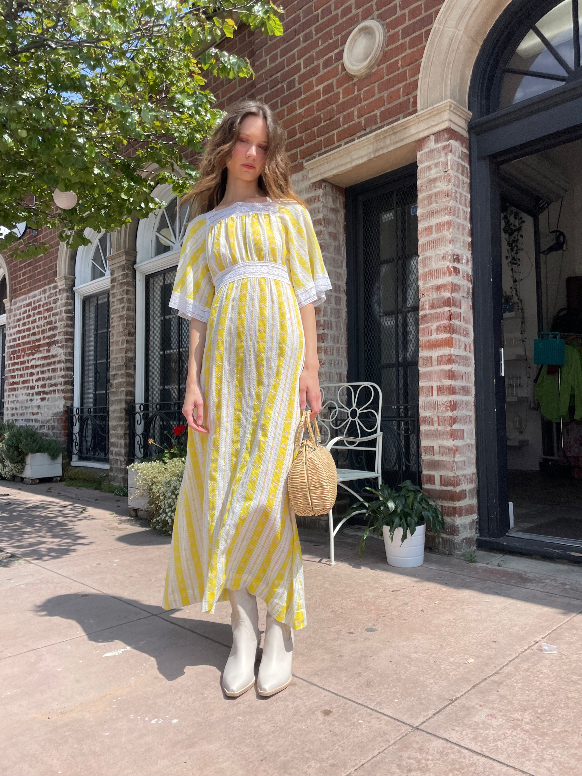 girl wearing long yellow and lace dress