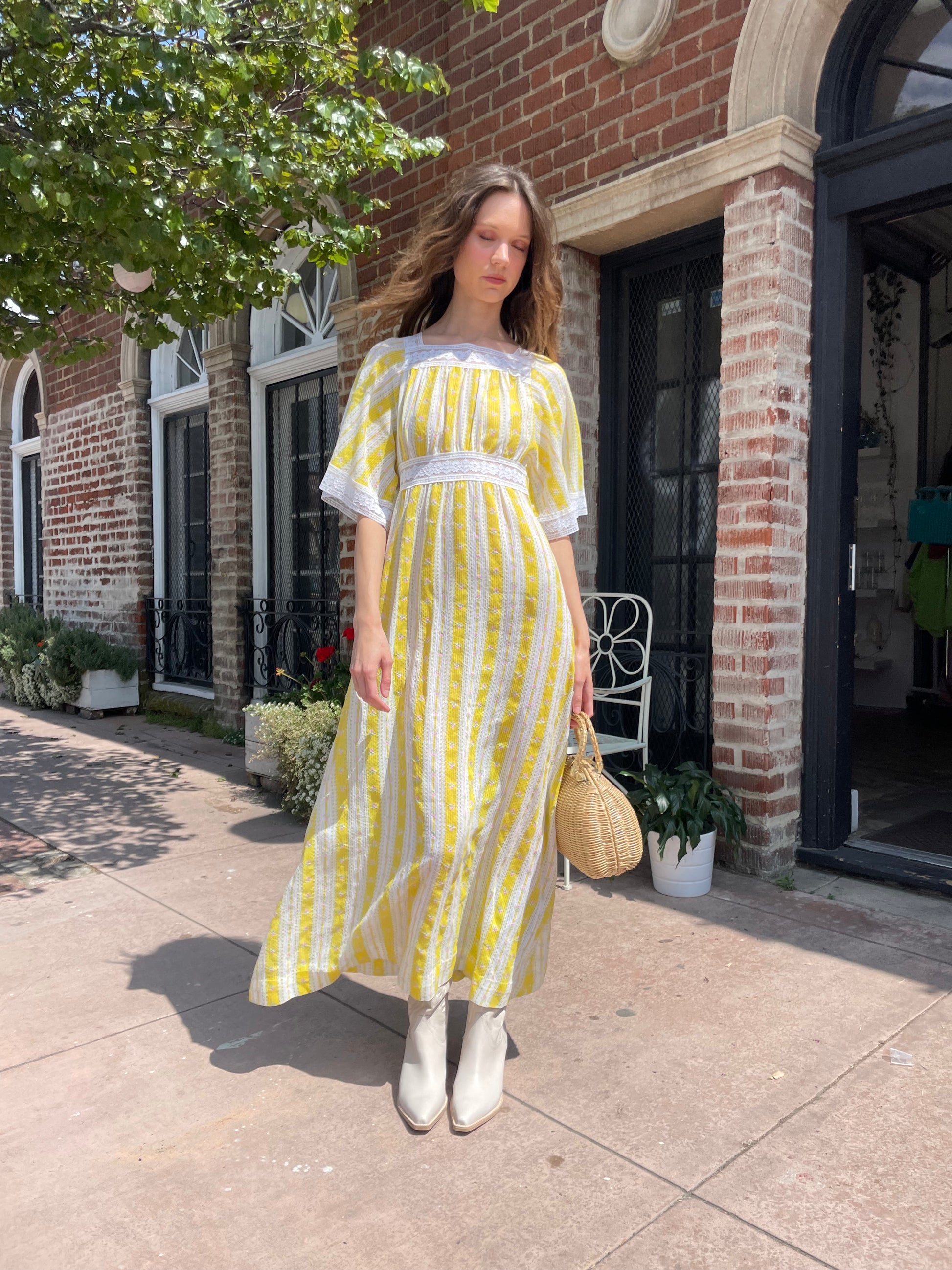 girl wearing long yellow and lace dress