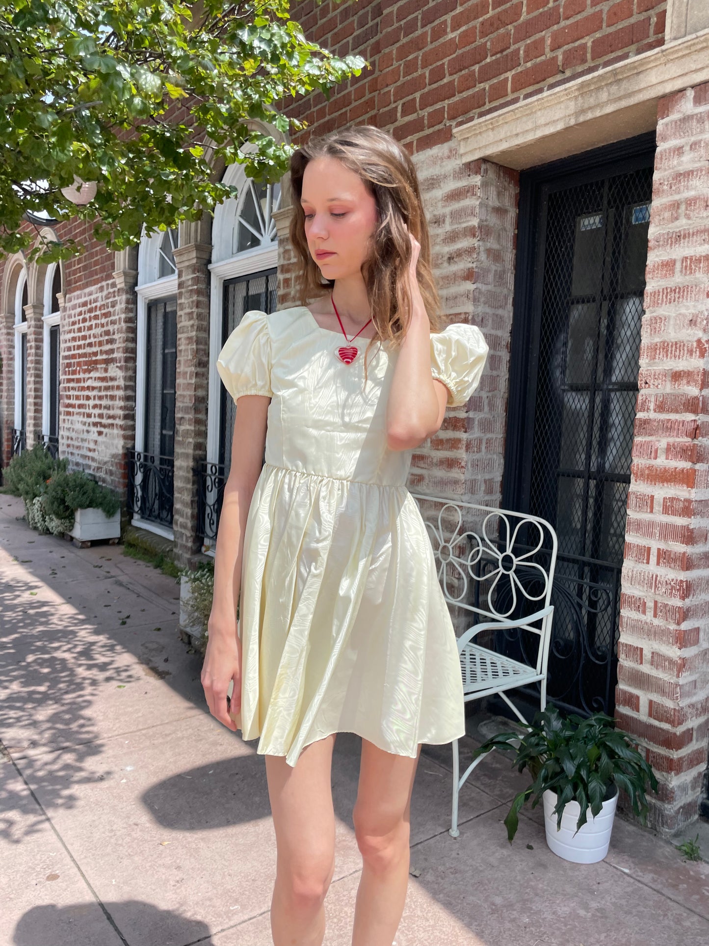 girl wearing yellow short dress