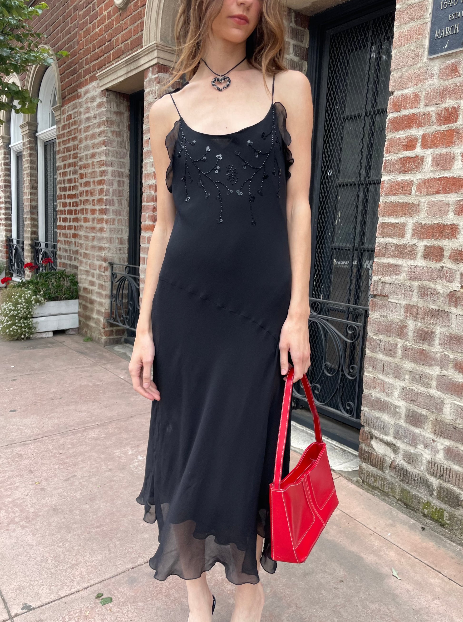 girl in black skinny strap dress