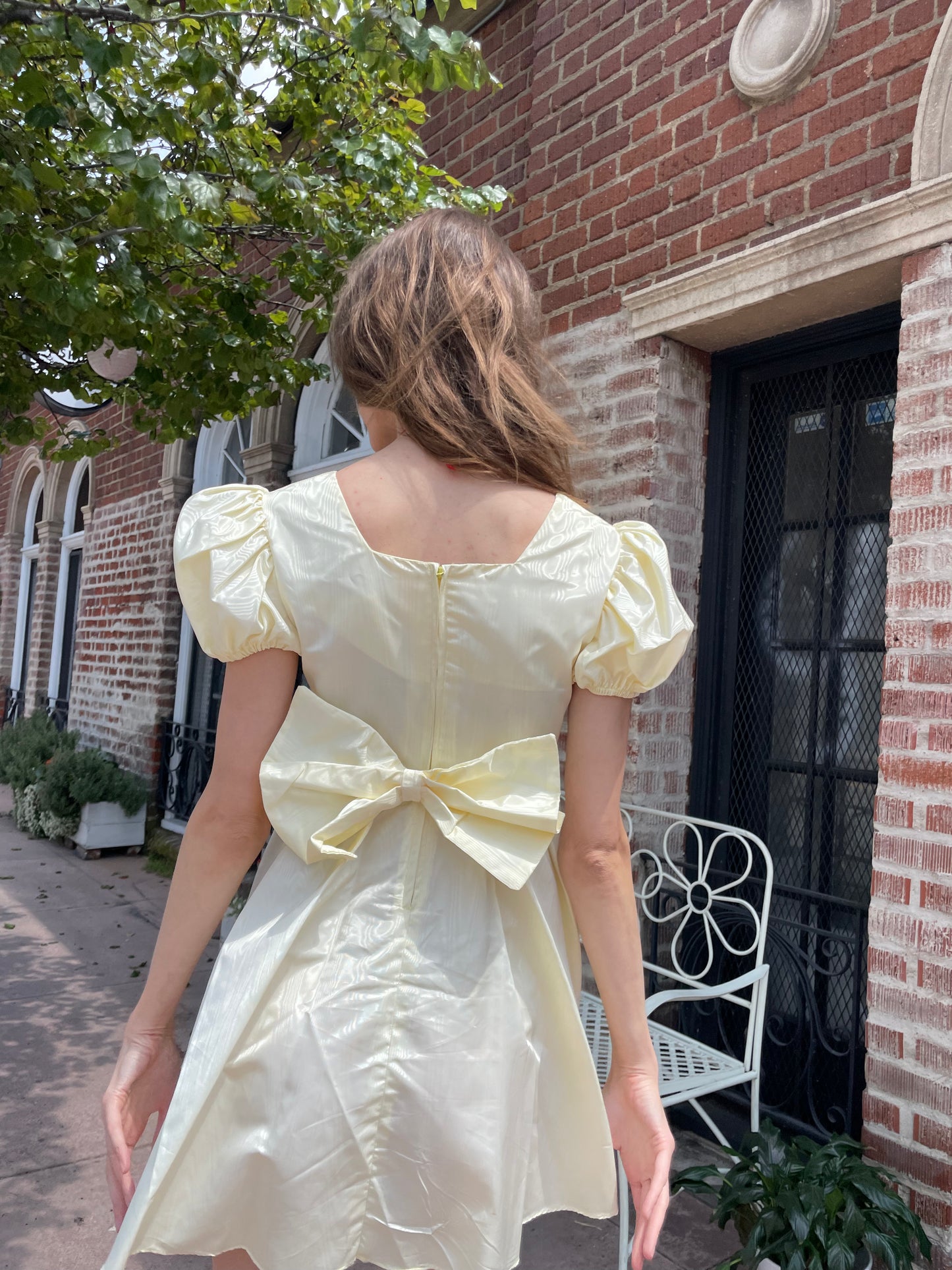 girl wearing yellow short dress