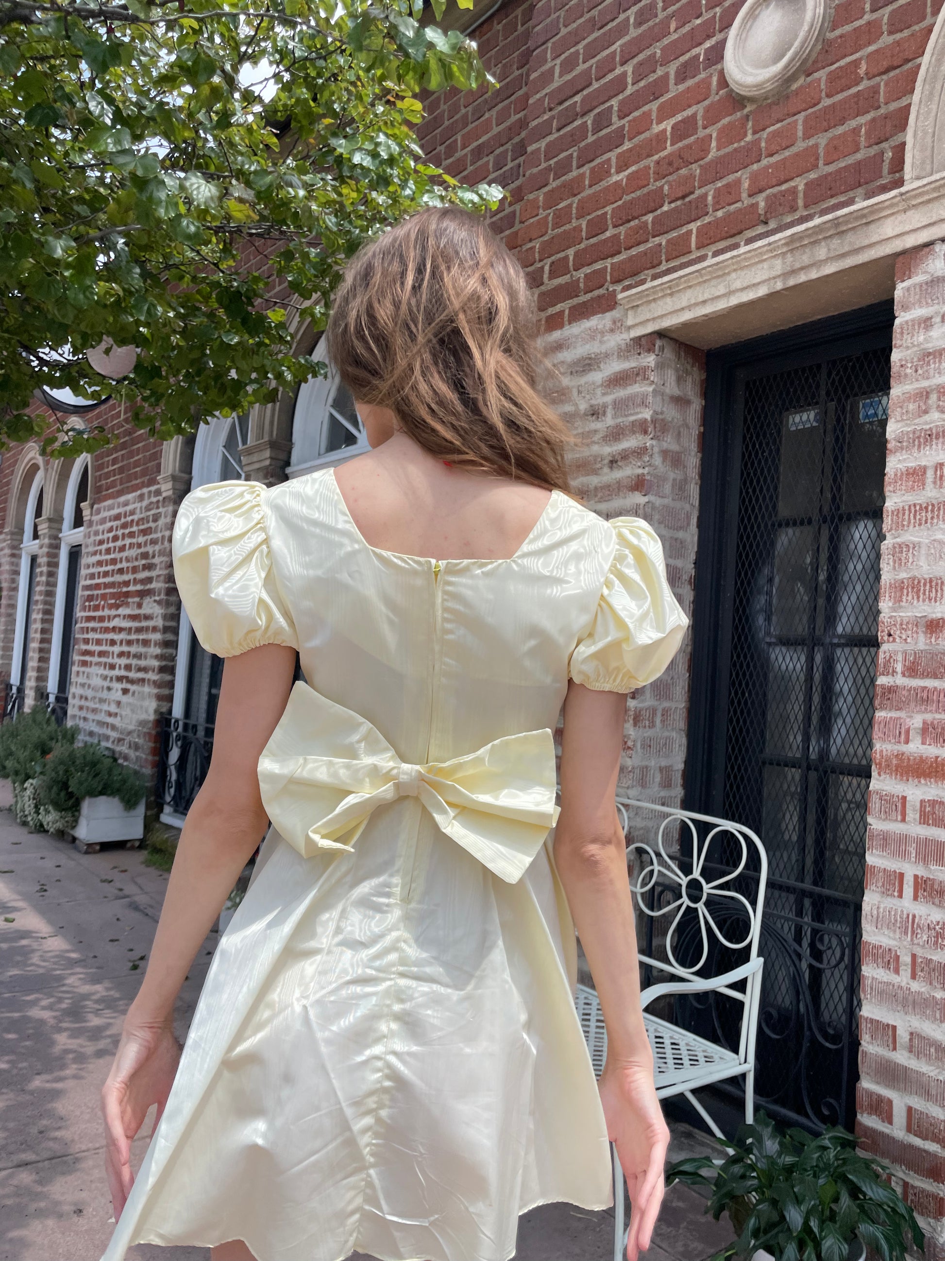 girl wearing yellow short dress