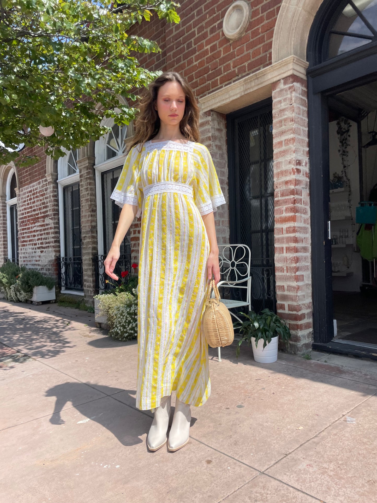 girl wearing long yellow and lace dress
