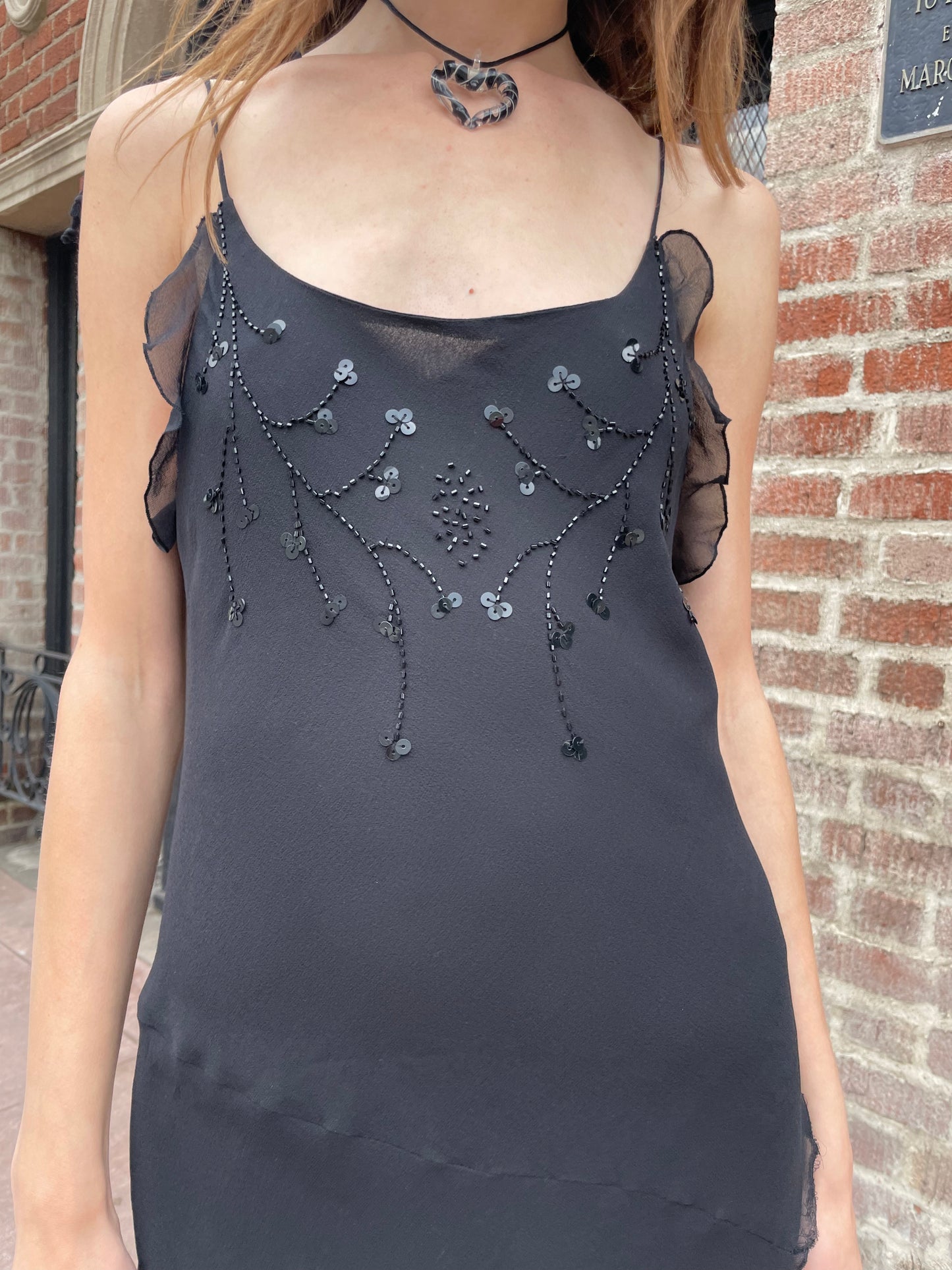 girl in black skinny strap dress