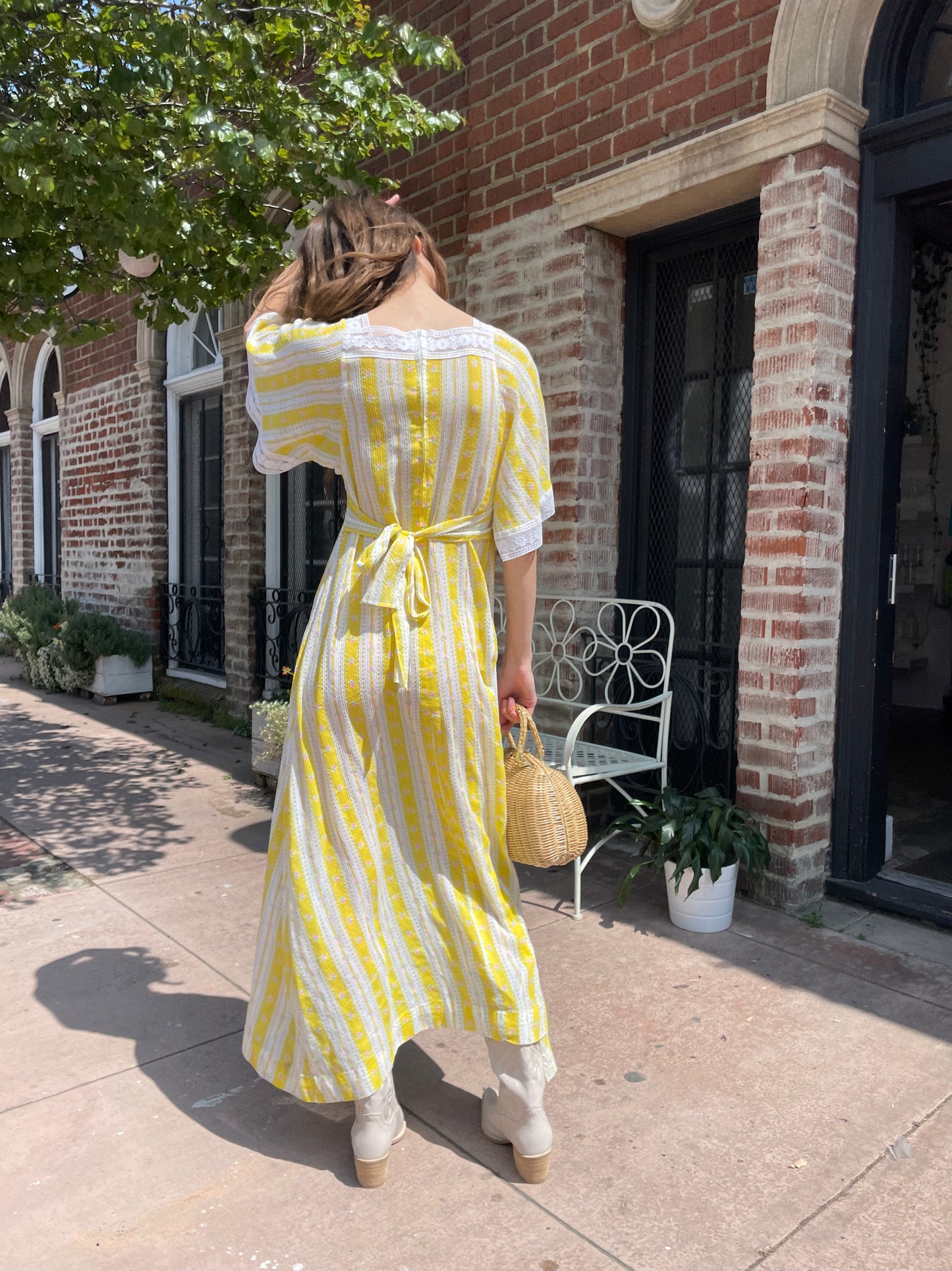 girl wearing long yellow and lace dress