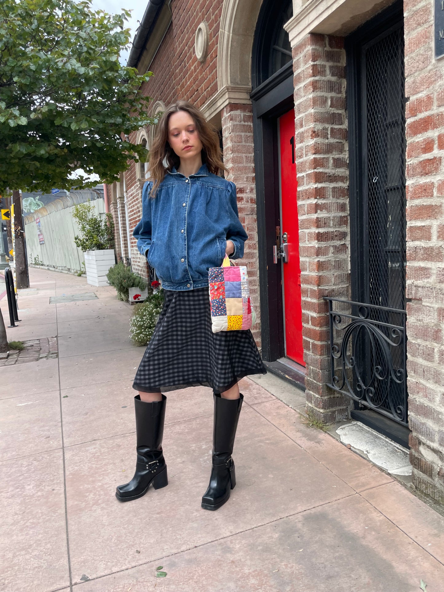 girl in plaid gingham skirt and denim jacket