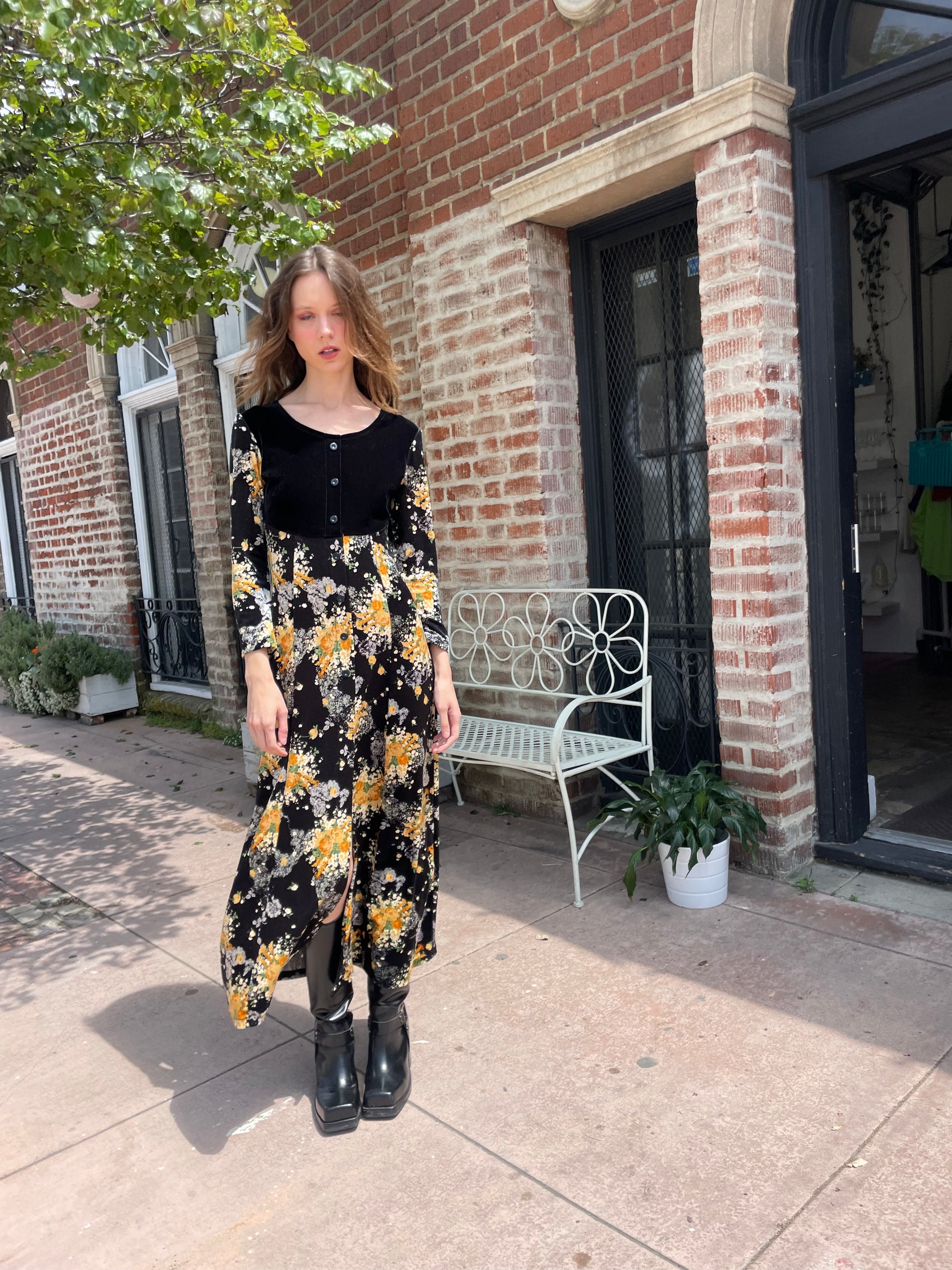 girl wearing long sleeve black and yellow dress