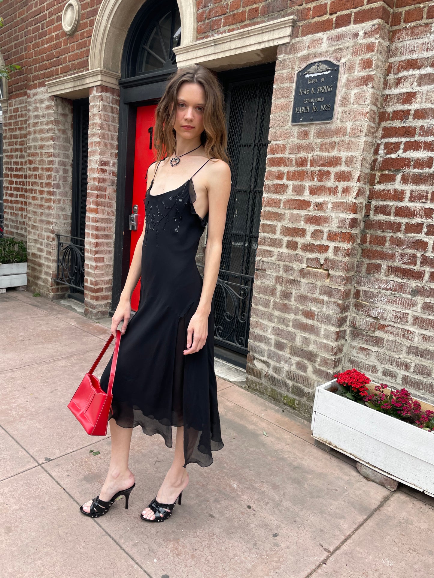 girl in black skinny strap dress