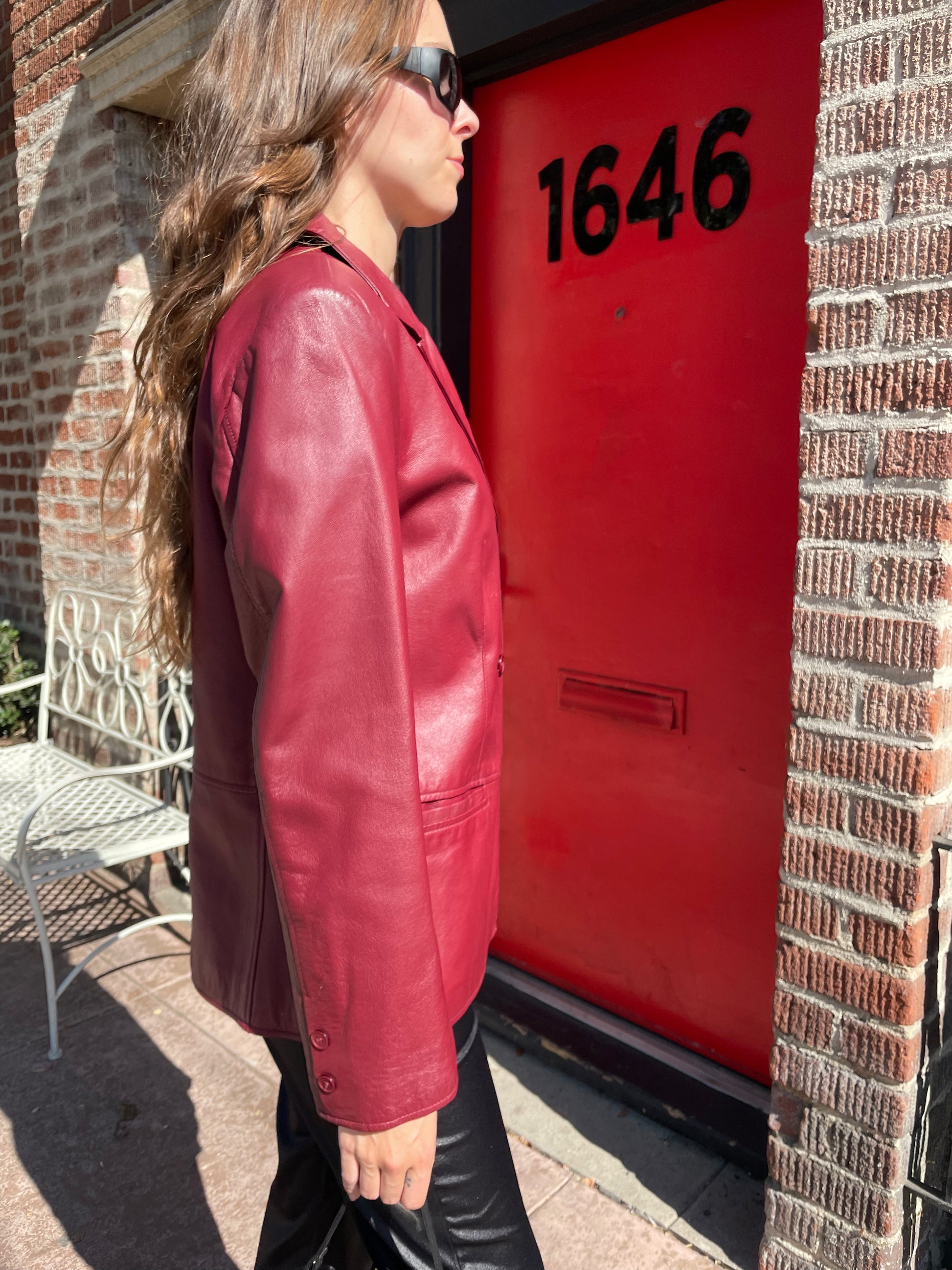 girl in red leather jacket and black leather pants