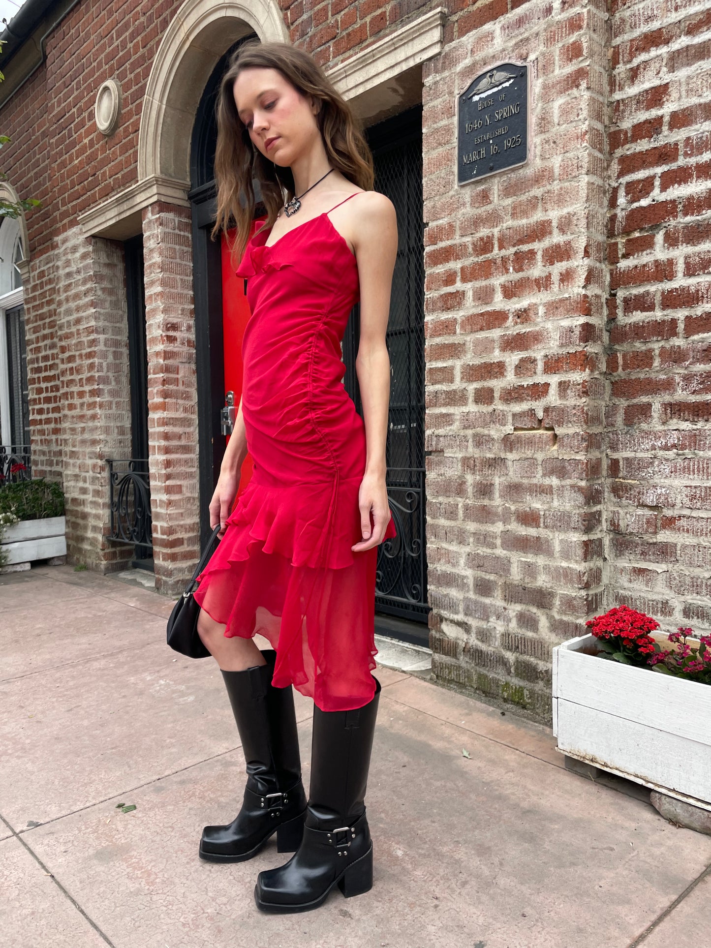 girl in black skinny strap dress