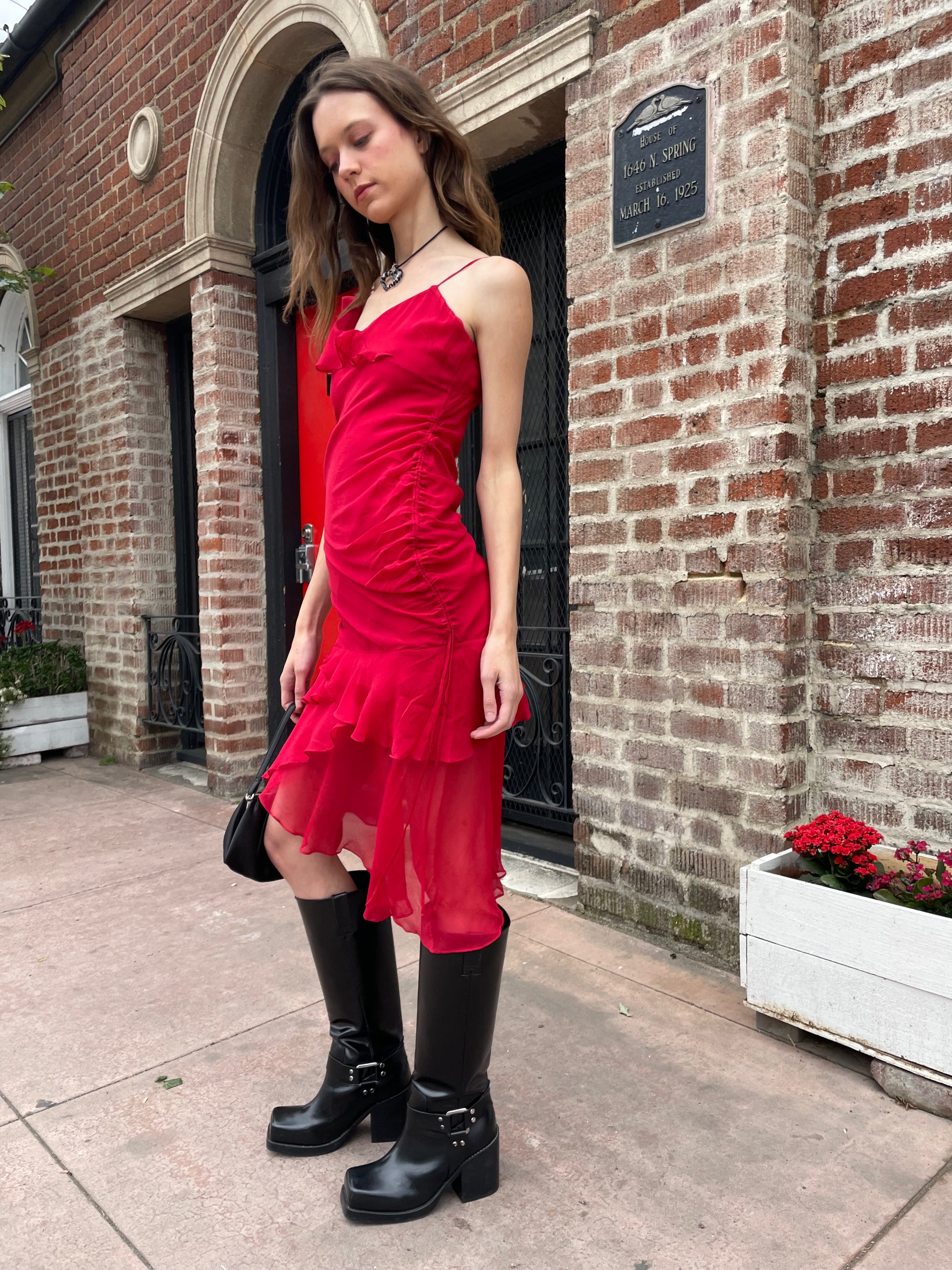 girl in black skinny strap dress