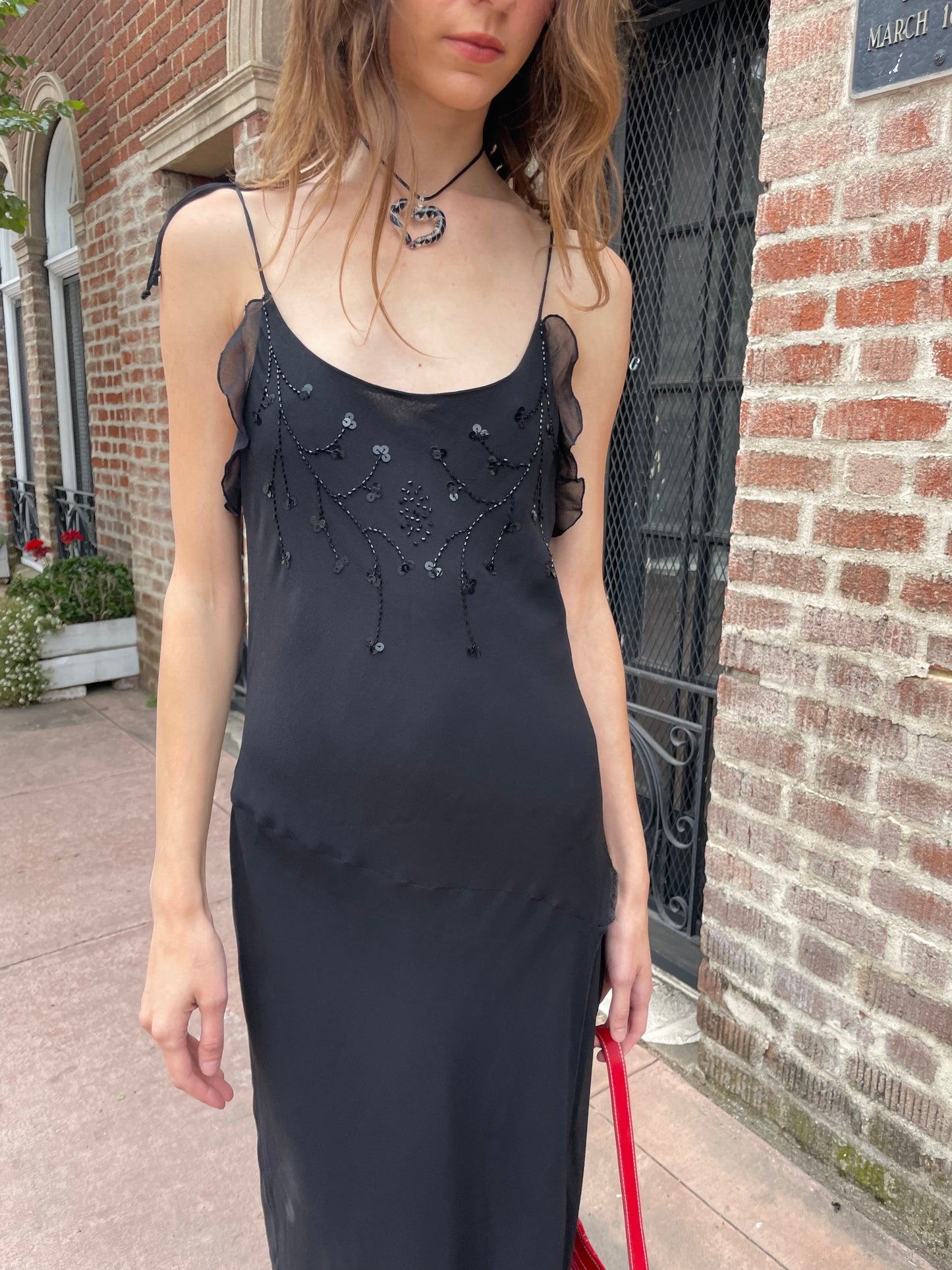 girl in black skinny strap dress