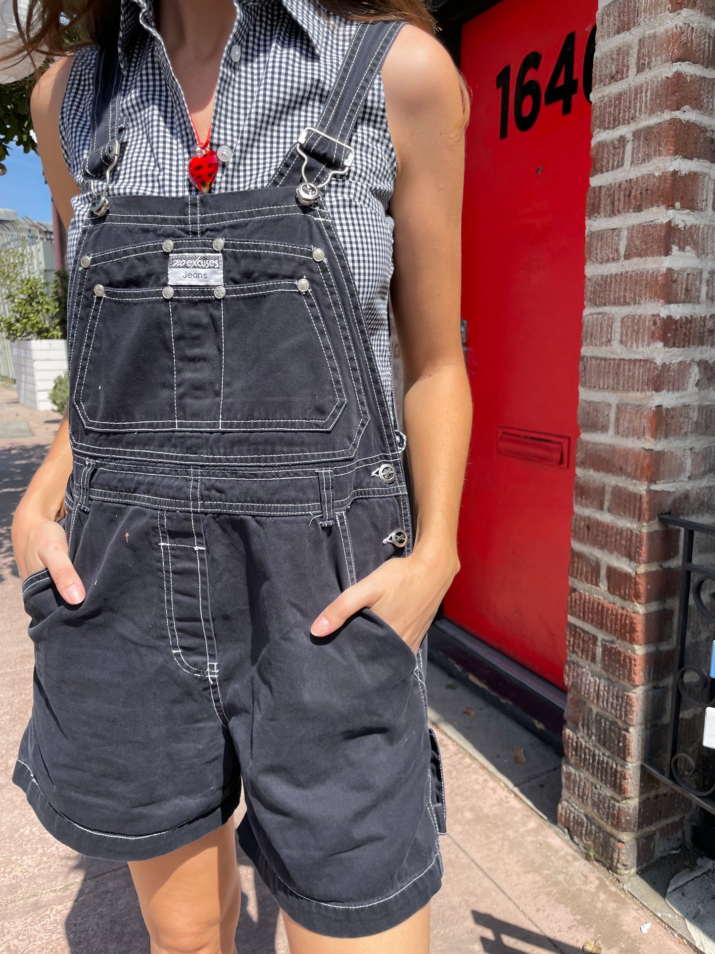 girl in black overalls